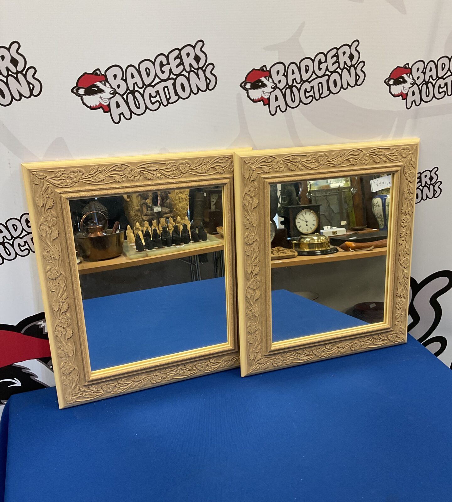 Pair of oak leaf pattern framed mirrors