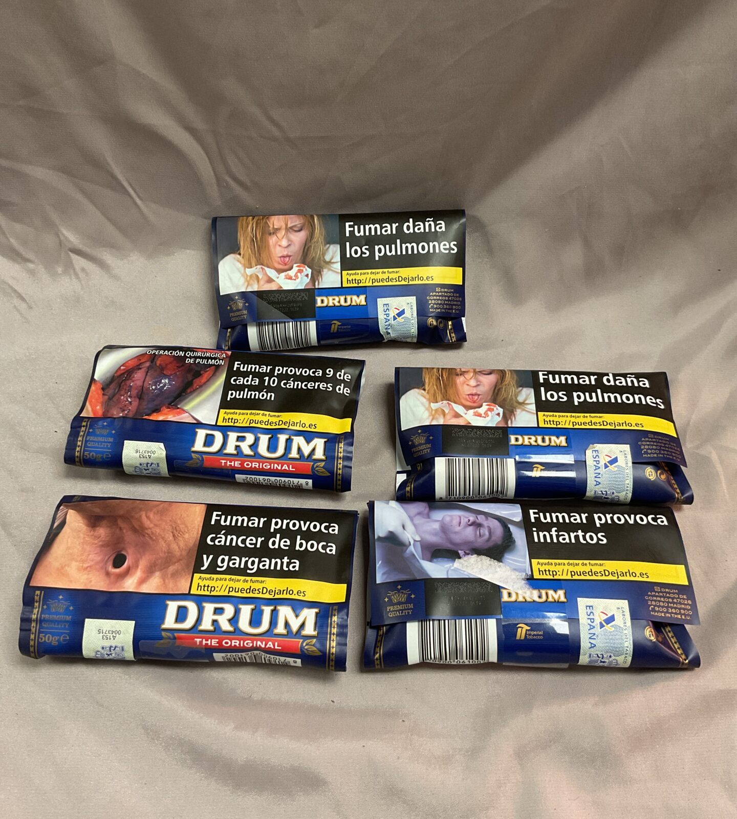 Five 50g sealed pouches of drum tobacco