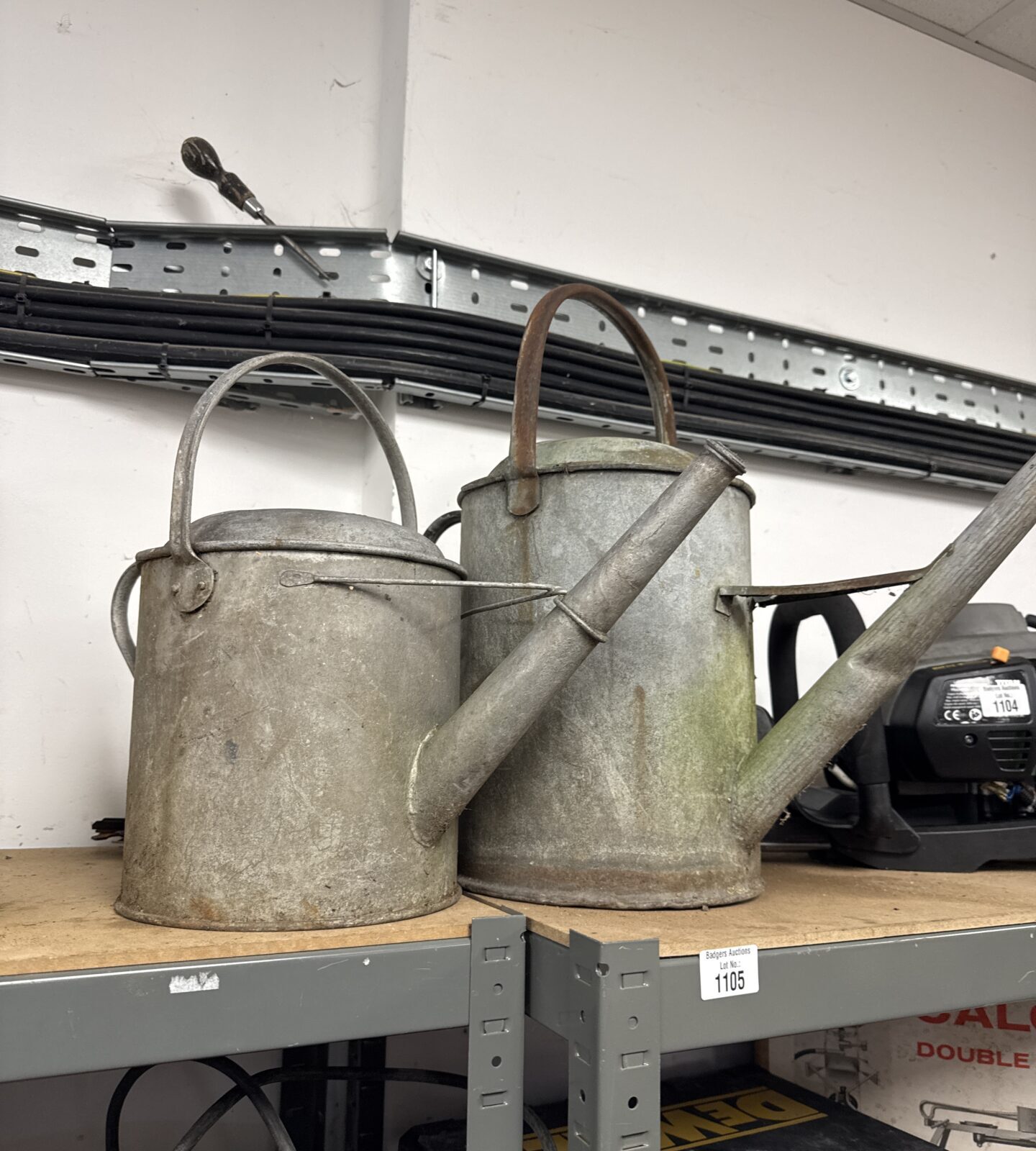 Two vintage galvanised watering cans