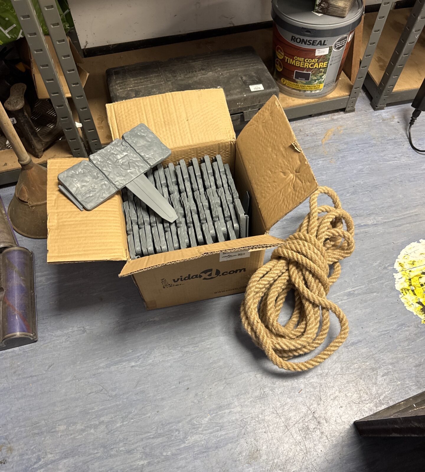 Length of thick rope with box of lawn edging