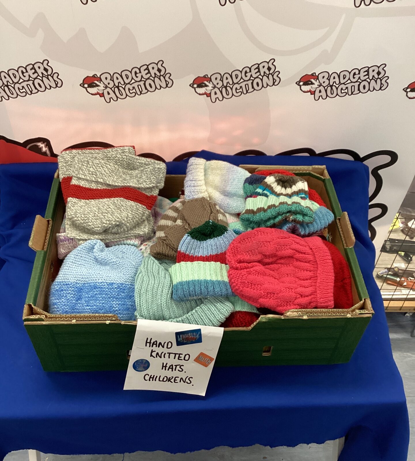 Tray of childrens hand knitted Hats