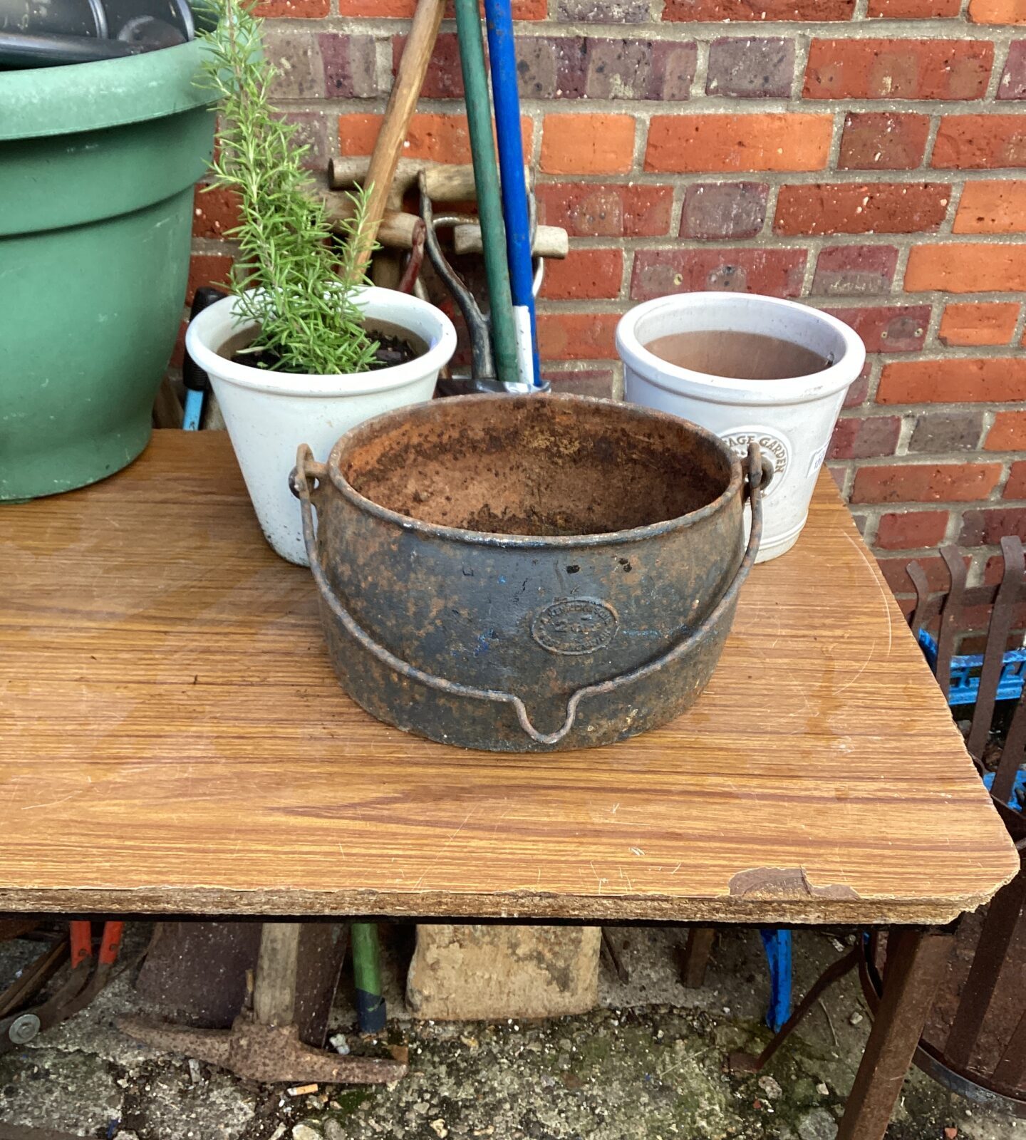 Cast iron pot with two flower pots