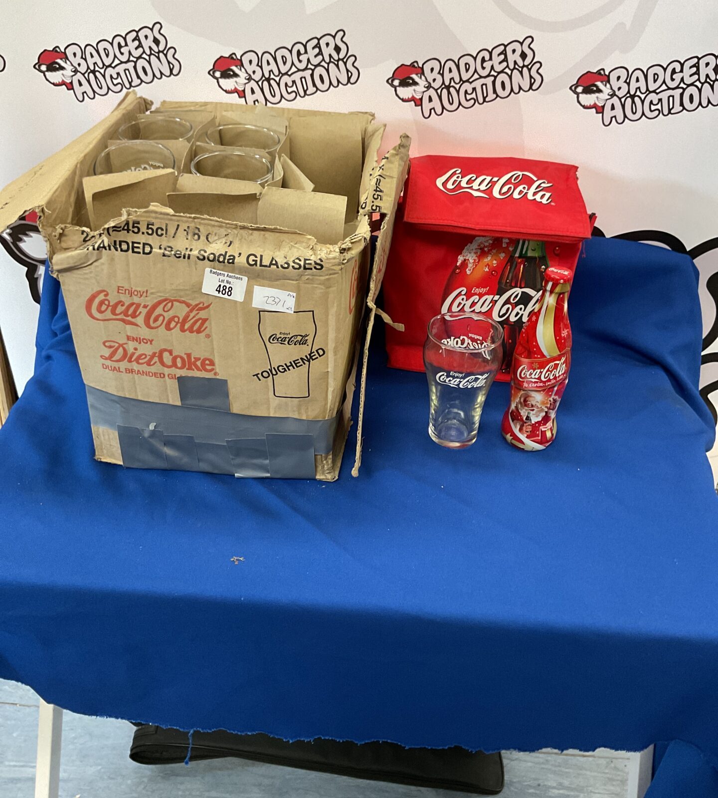 Selection Of coca cola items inc box of glasses, unopened bottle and bag