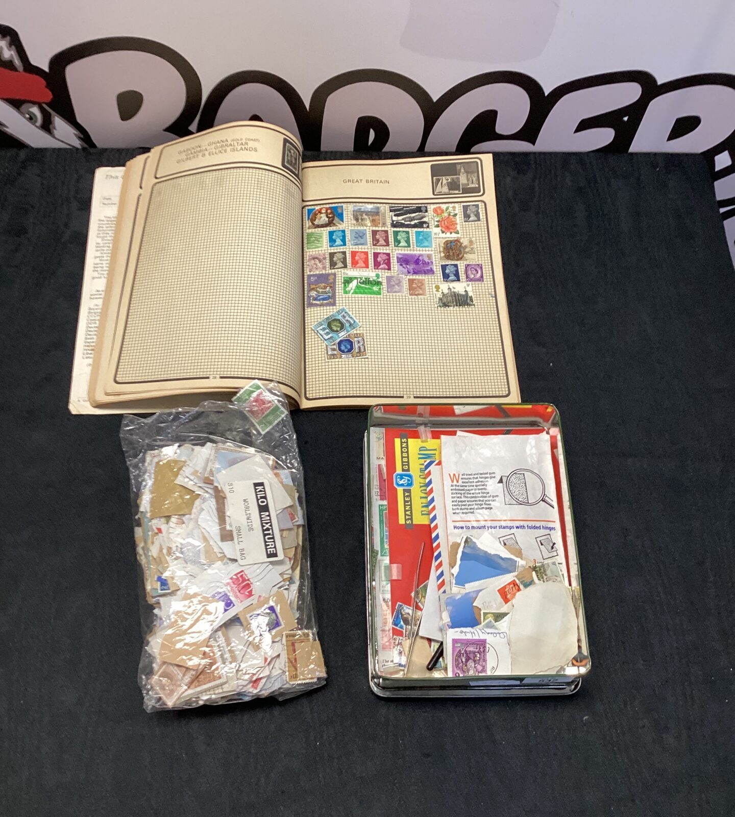 Stamp collection with stamp album & stamps from around the world