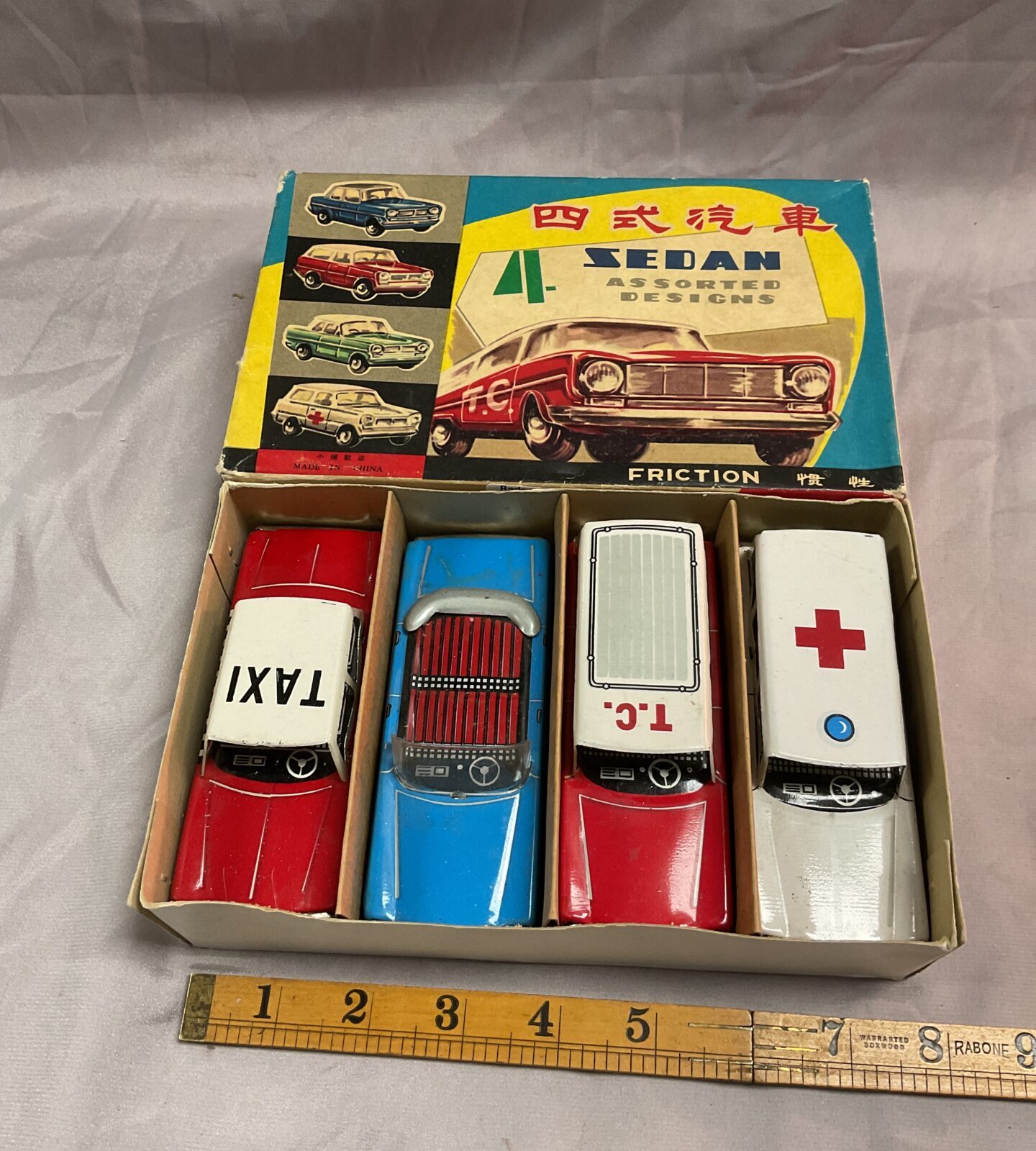 Four Vintage Chinese tin friction cars