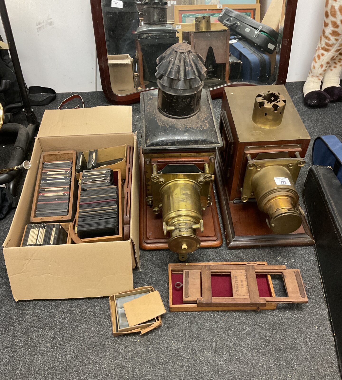 Two victorian magic lanterns with collection of glass slides