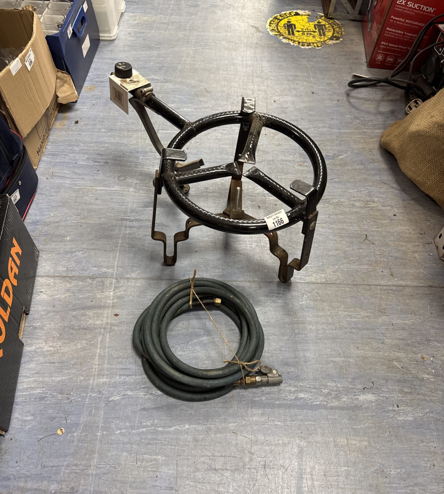 Large calor gas stove with length of hose with car tyre attachment