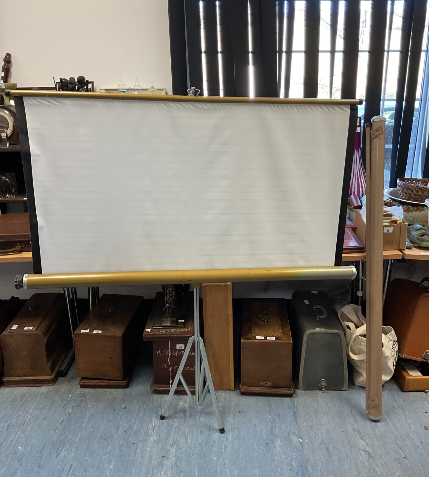 Two vintage folding projector screens