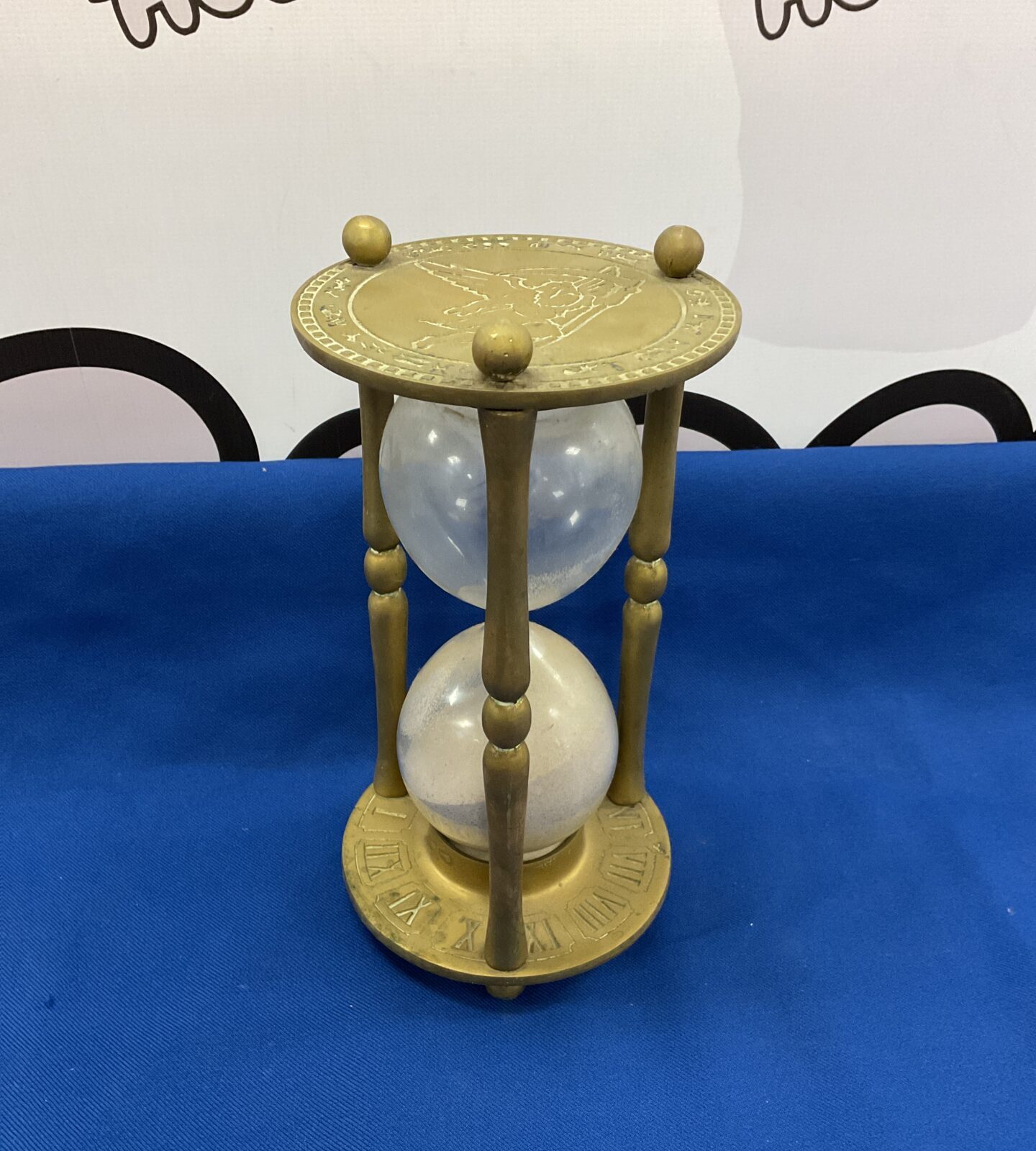 Large brass hourglass with angel relief