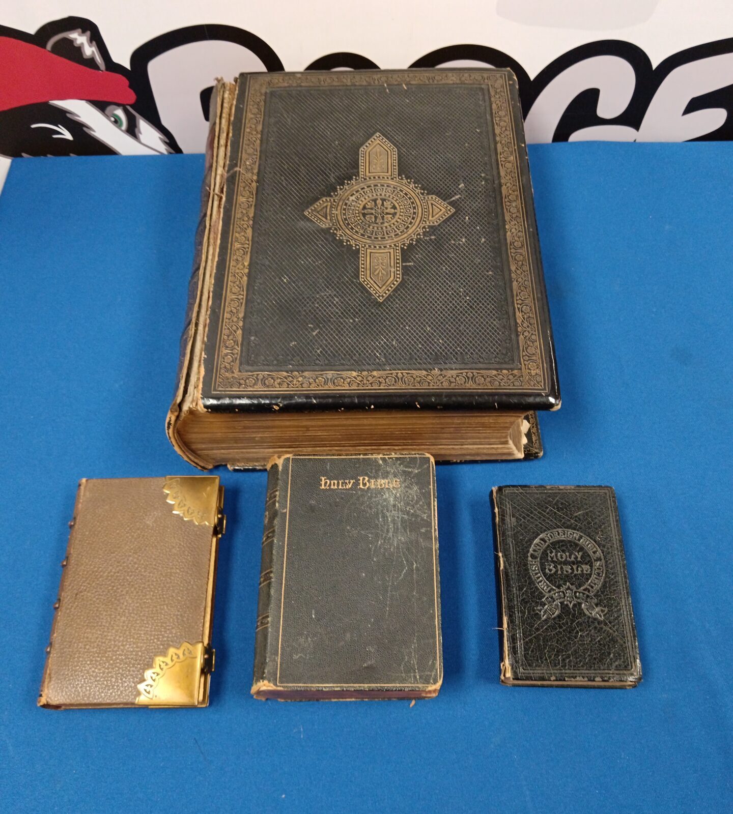 Four antique bibles including Victorian family devotional bible