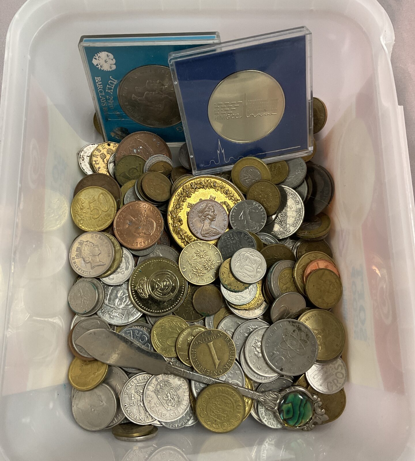 Tub of assorted coins