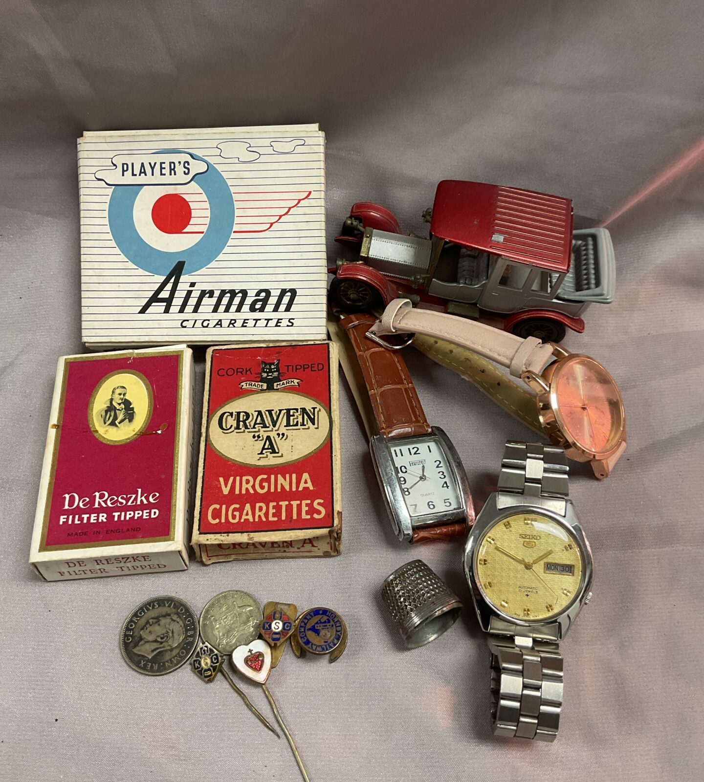 Tray mixed inc Seiko watch badges and vintage cigarette packets