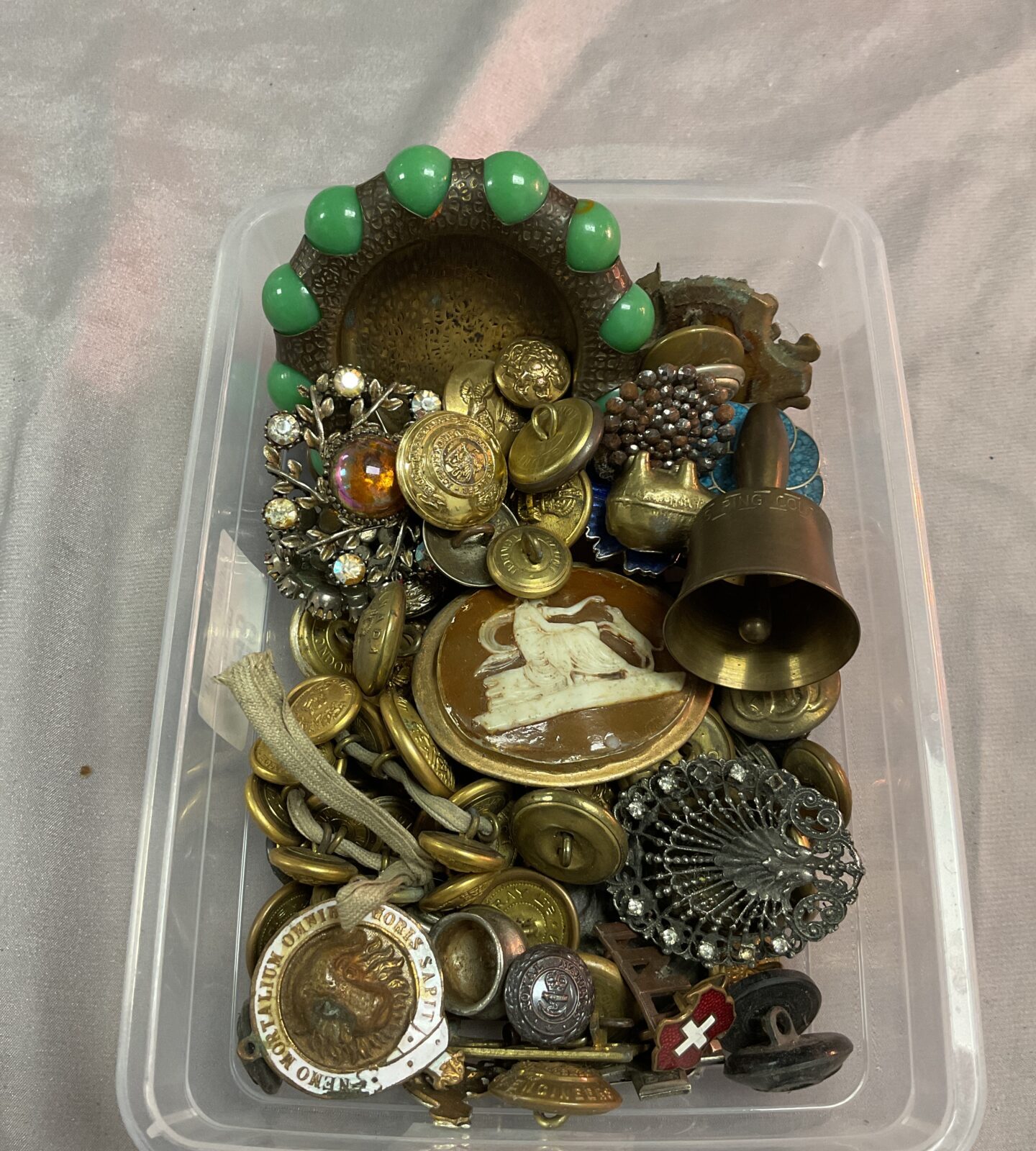 Tray of assorted military buttons costume jewellery and badges