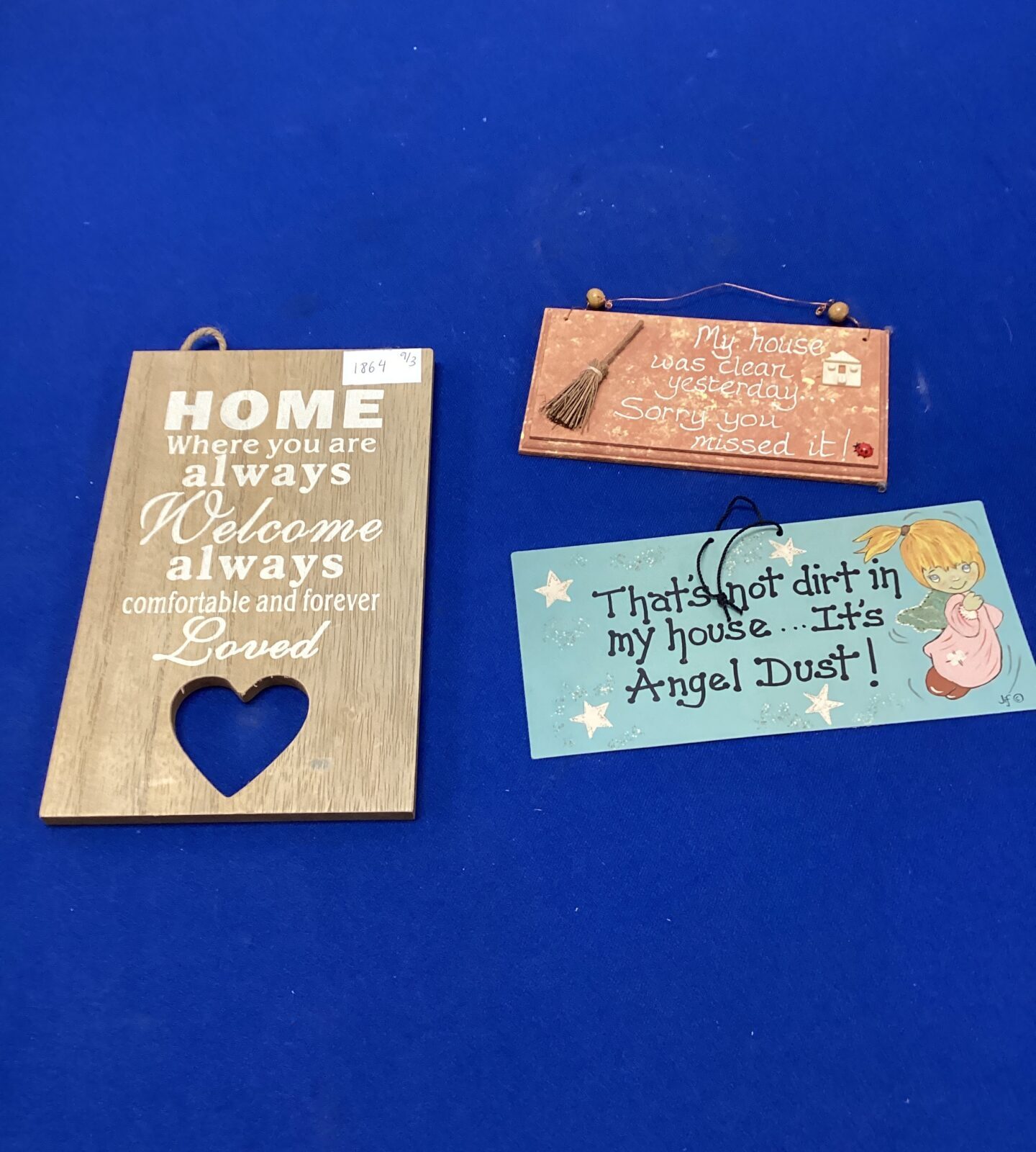 Three wall hanging homely signs