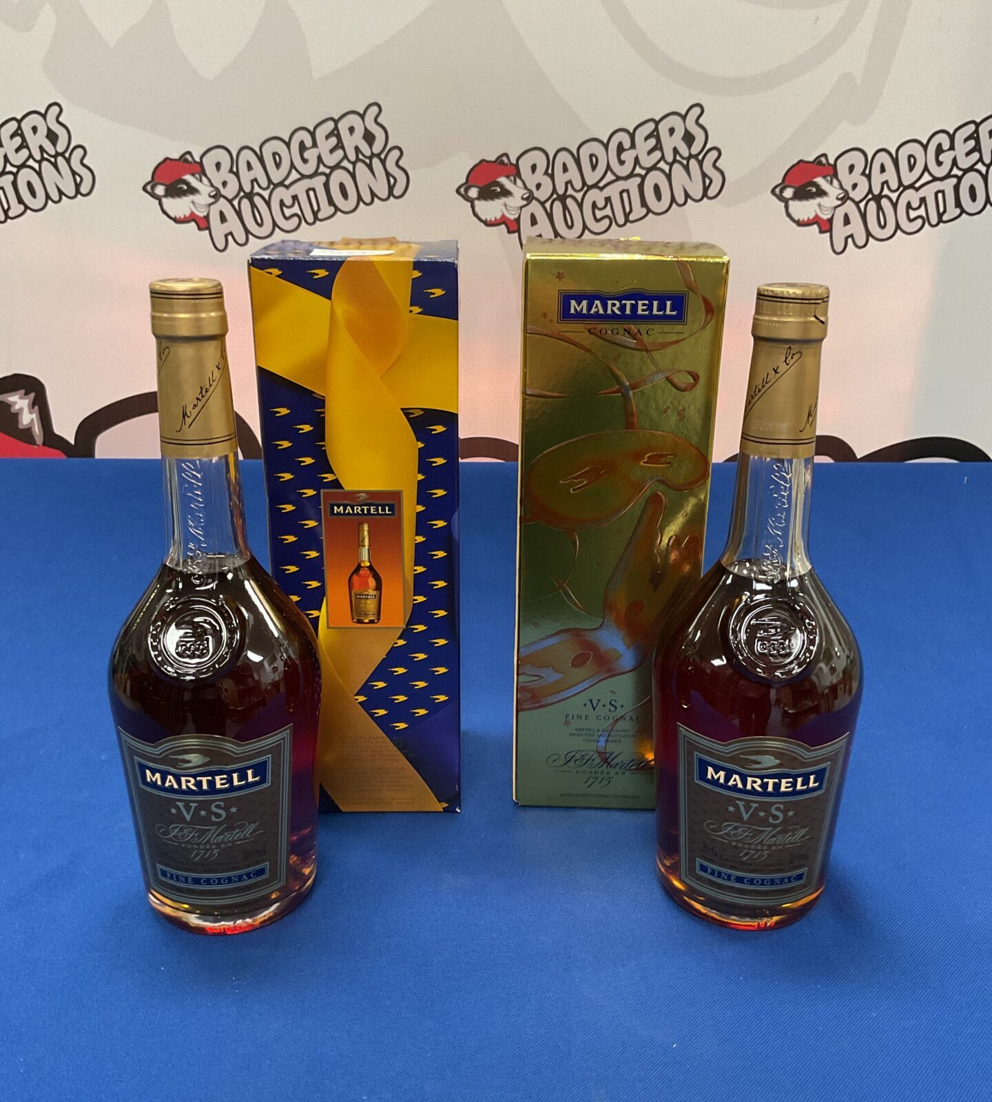 Two sealed bottles of martell cognac