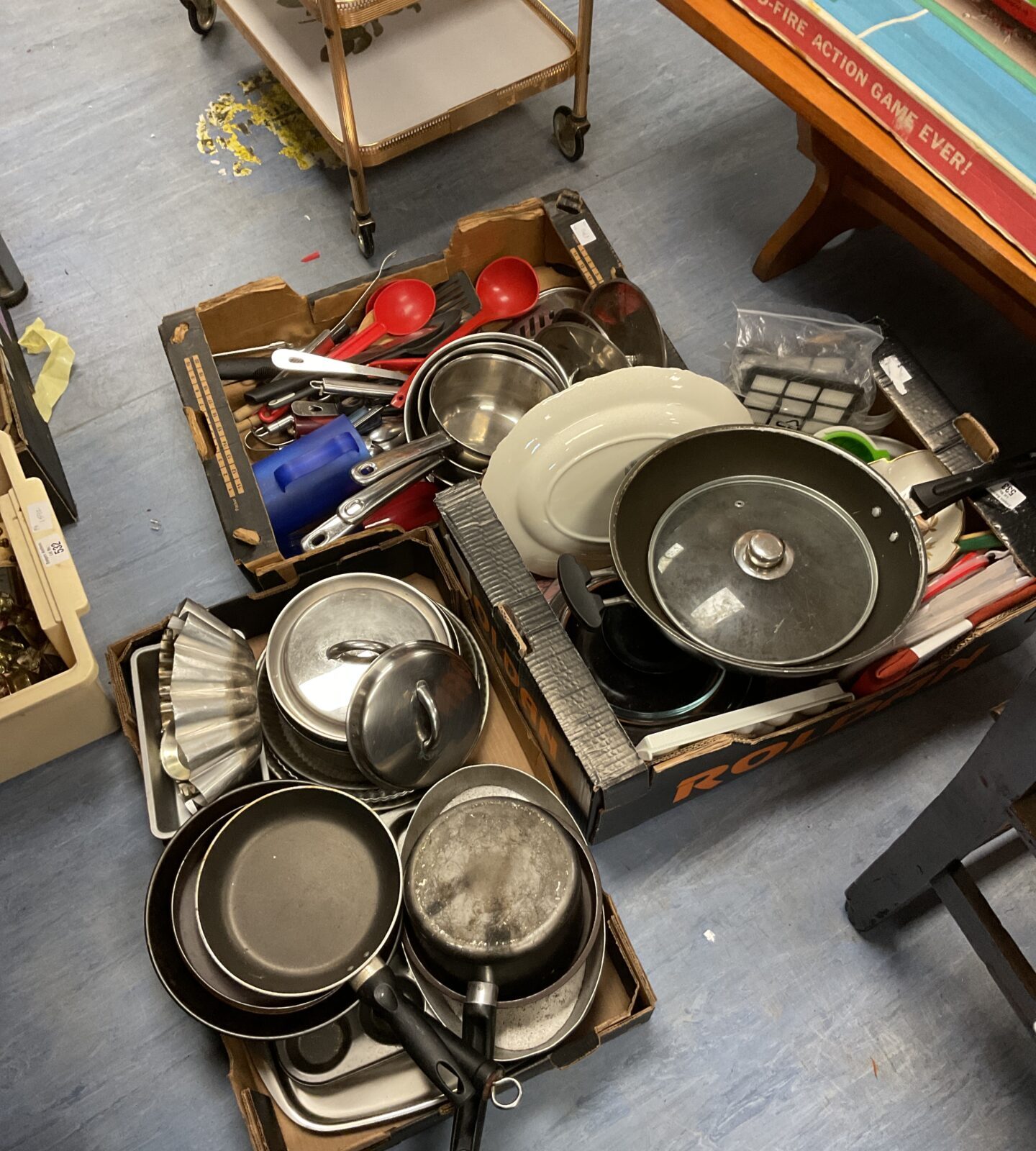 Three trays of cookware inc pots & pans