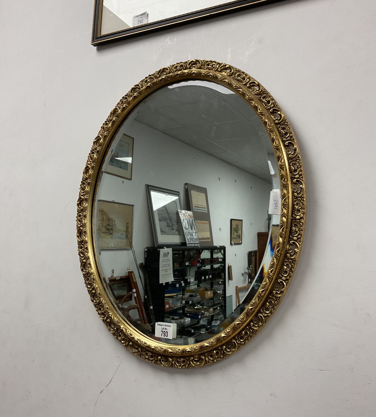 Oval Gilt framed bevel edged mirror