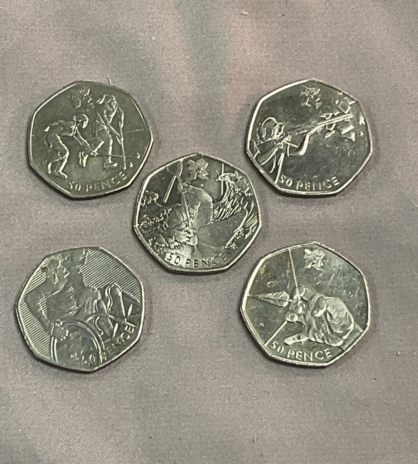 Five 50p coins Inc archery shooting hockey ect