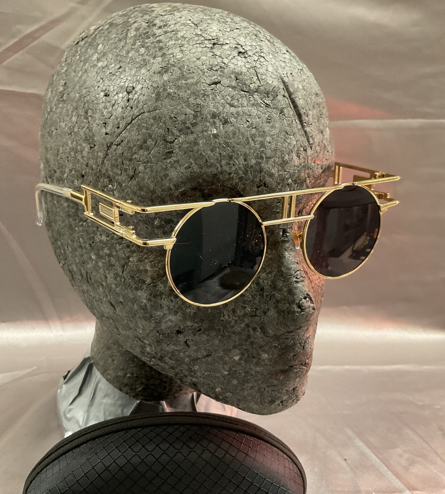 Pair of steampunk sunglasses with case