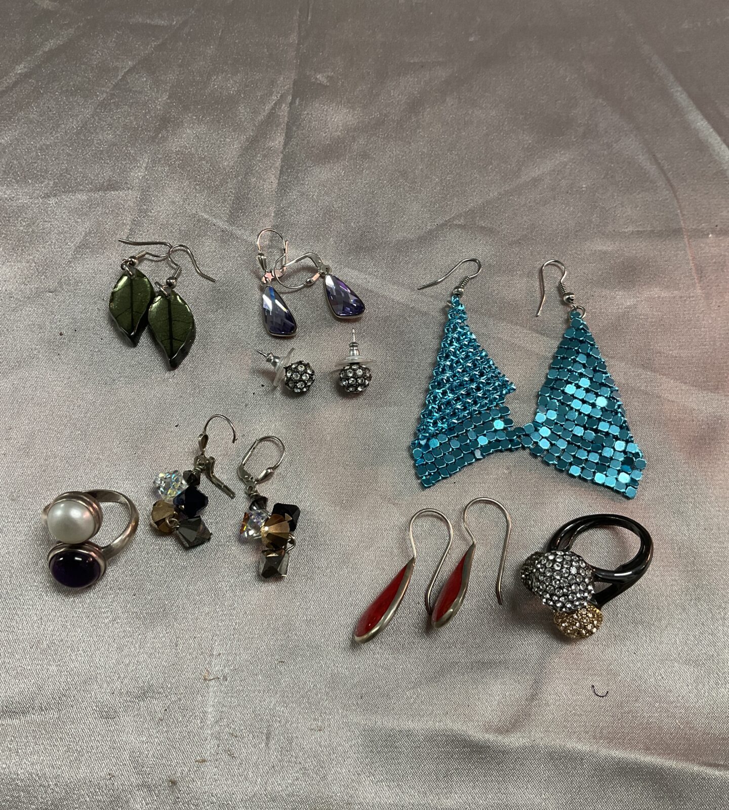 Six pairs of earrings and two rings