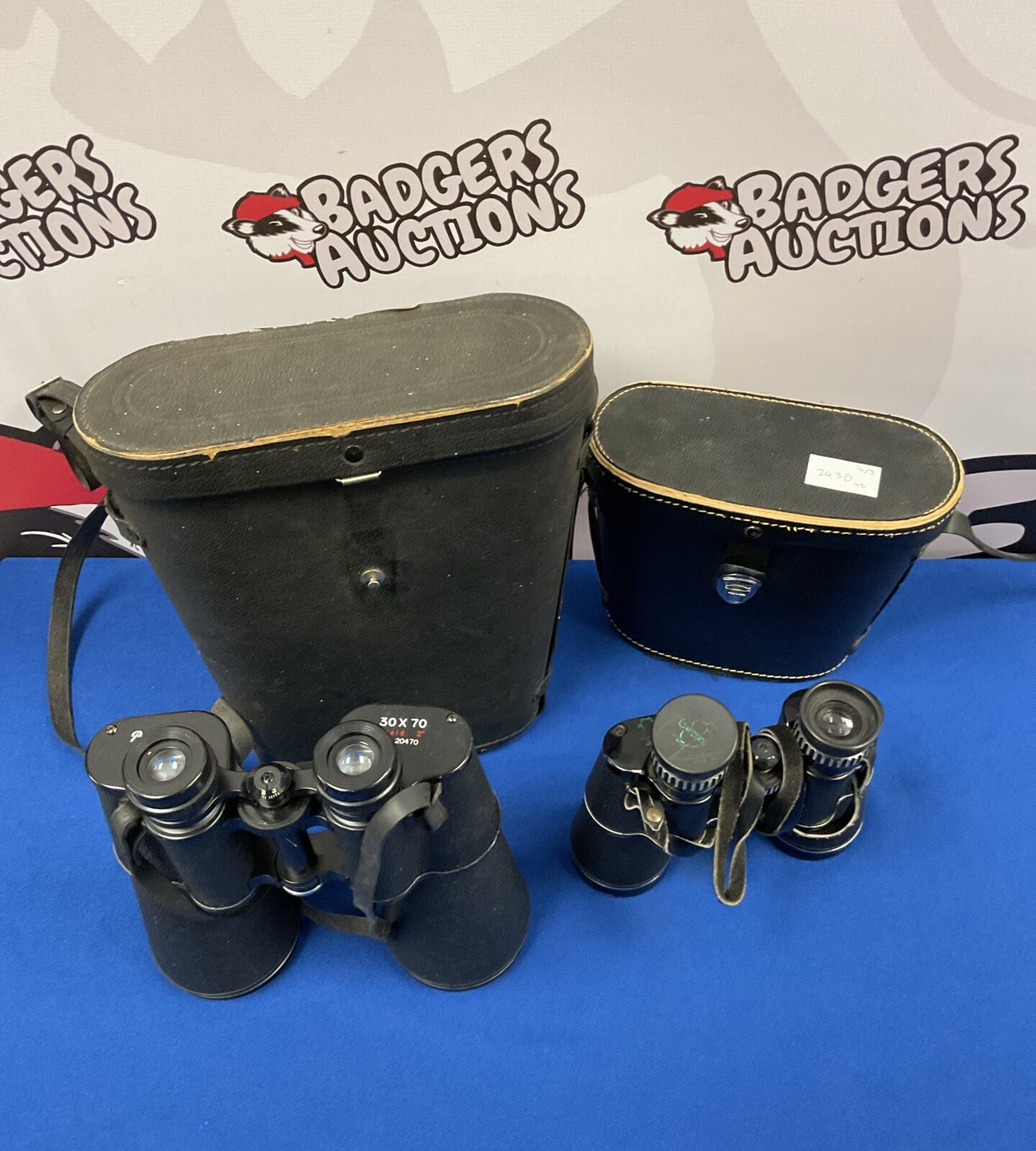 Two pairs of binoculars including pathescope 30x70 & greencat 10x50