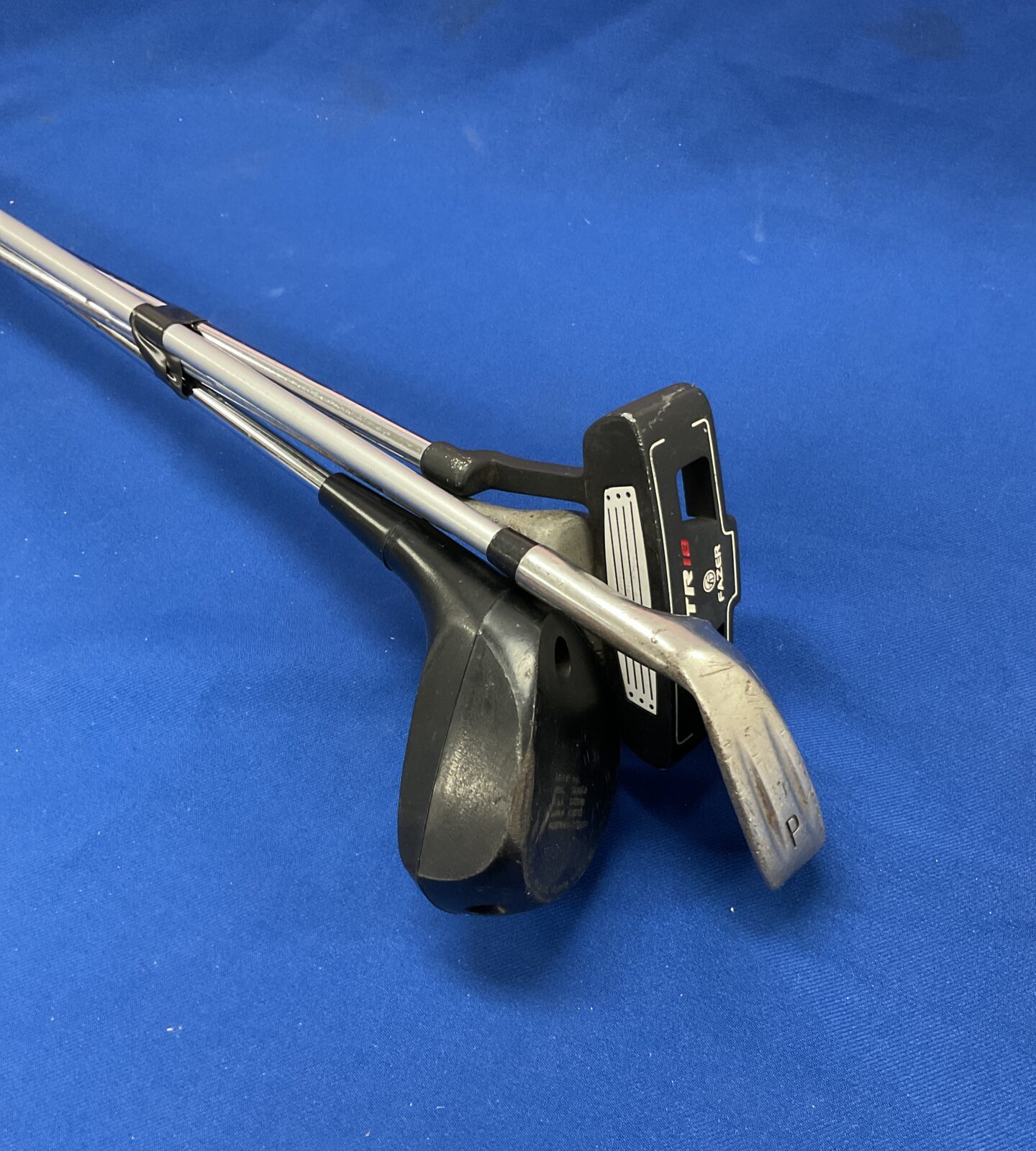 Bundle of golf clubs inc fazer putter & swimgrite powerdrive club