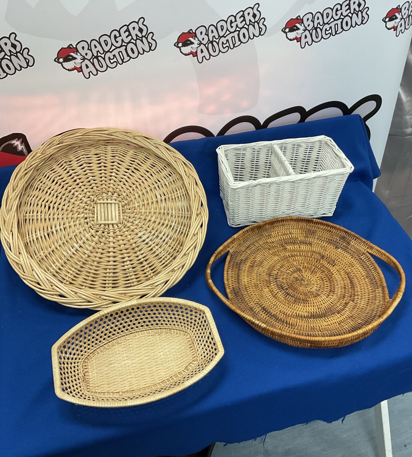 Four wicker display baskets