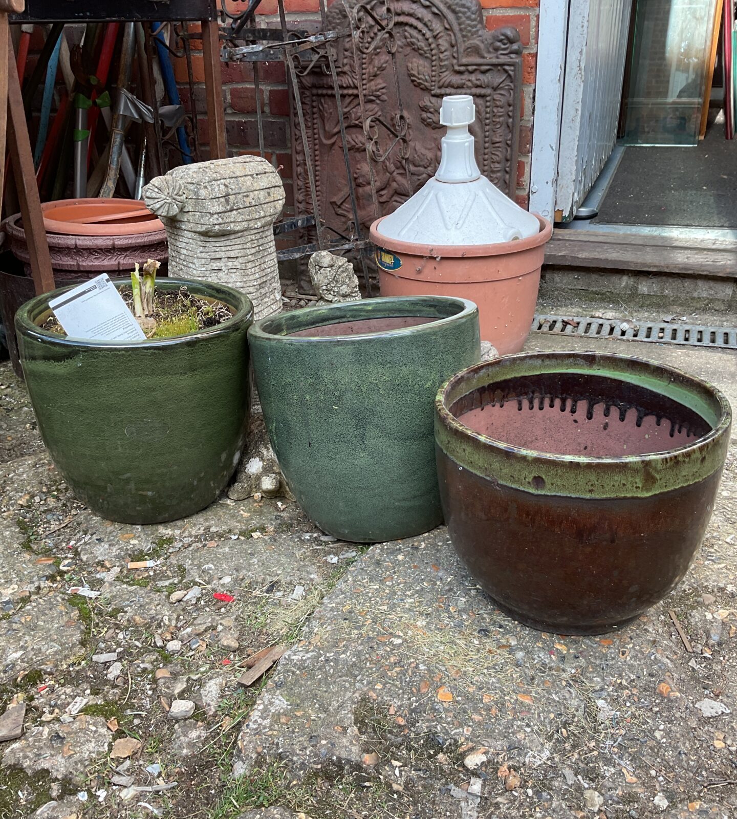 Three green glazed plant pots