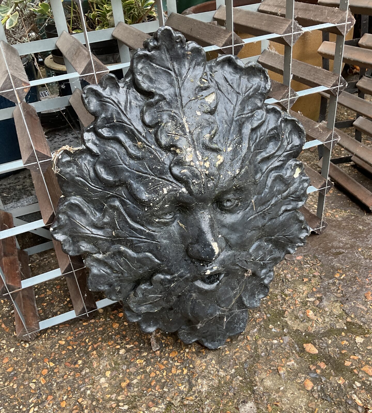 Concrete green man face garden ornament