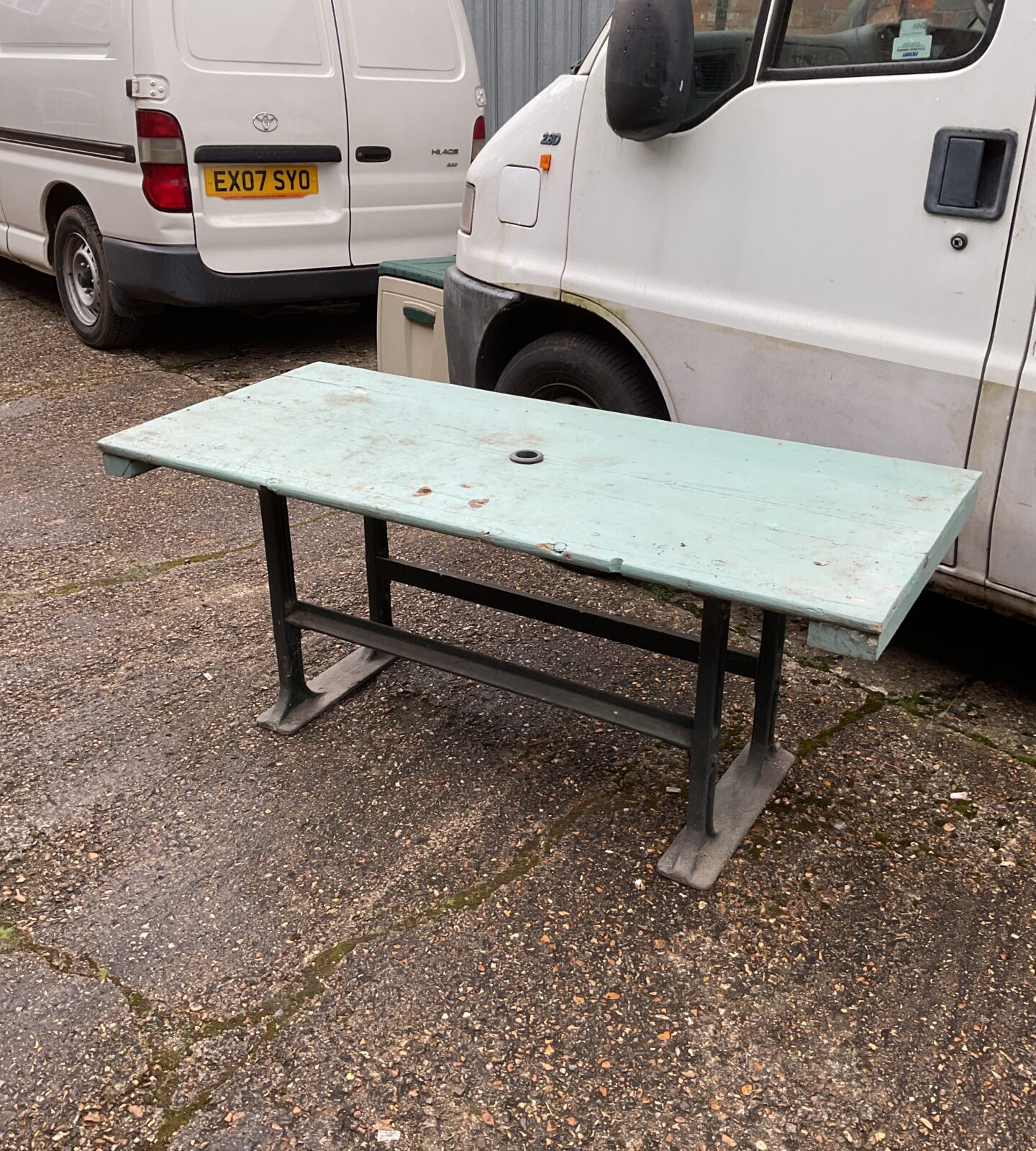 Garden table with cast iron base