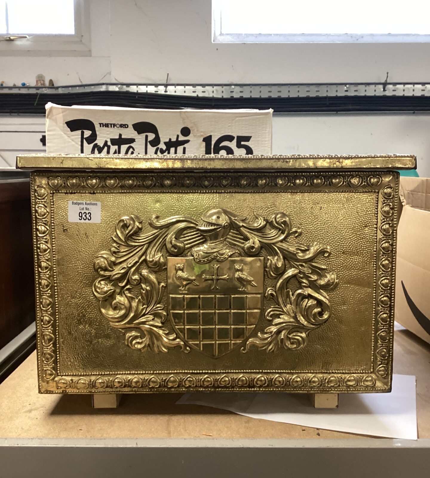 Vintage brass log box with heraldic crest