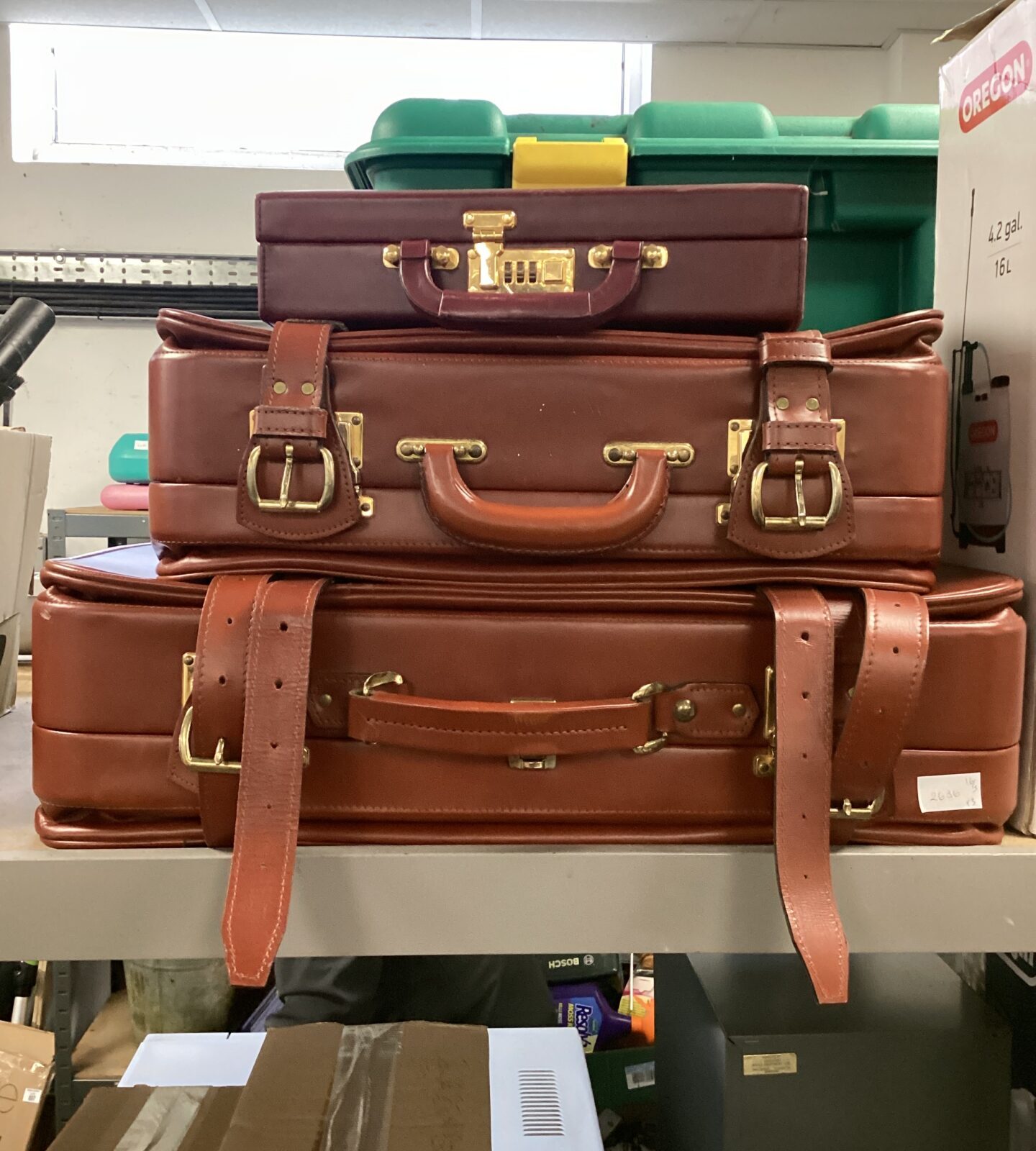 Two brown leather suitcases & small maroon Briefcase