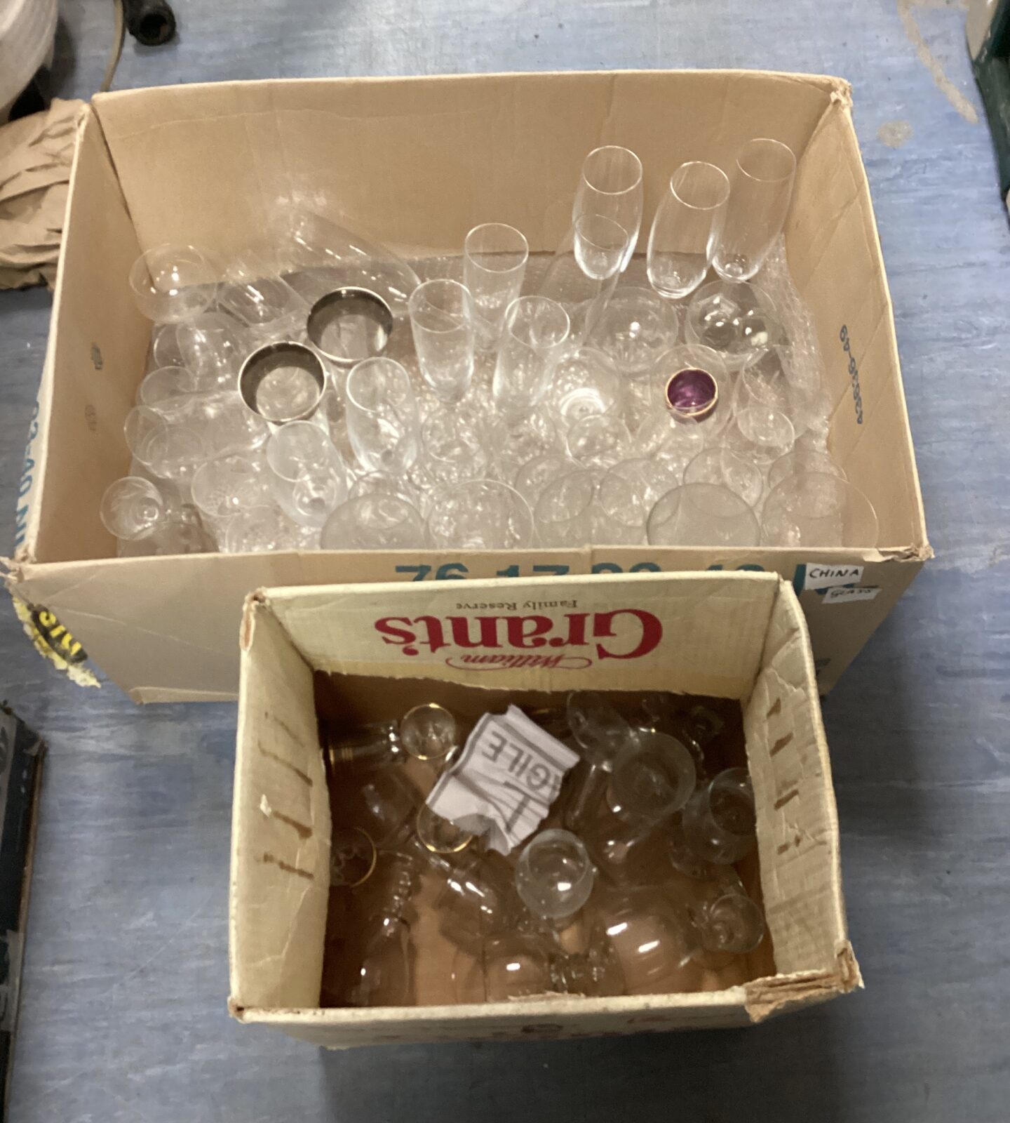 Two boxes of mixed glassware inc champagne flutes & sherry glasses