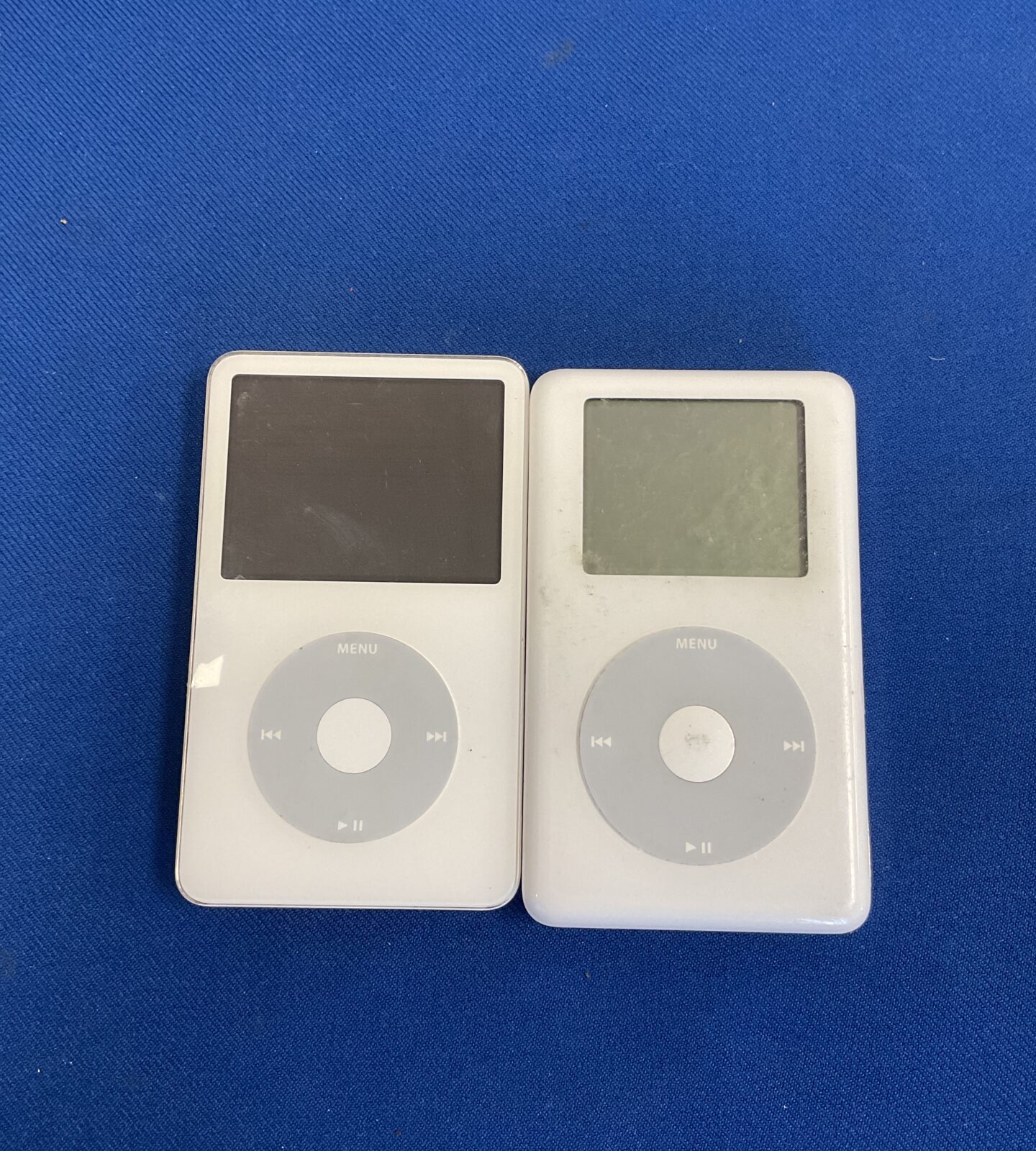 Two apple ipods (one has broken screen