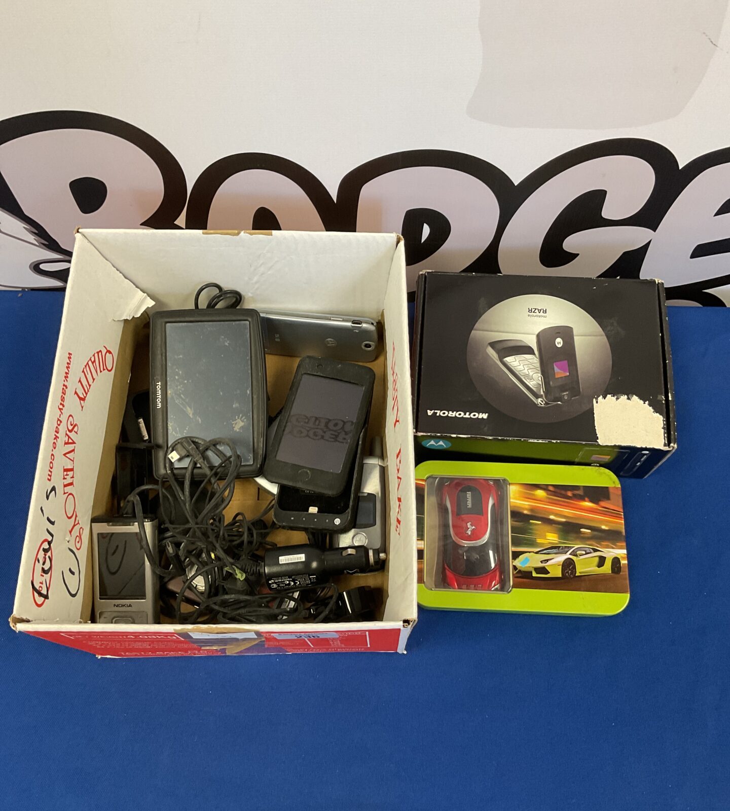 Box of mobile phones inc Motorola razor & ferrari phone