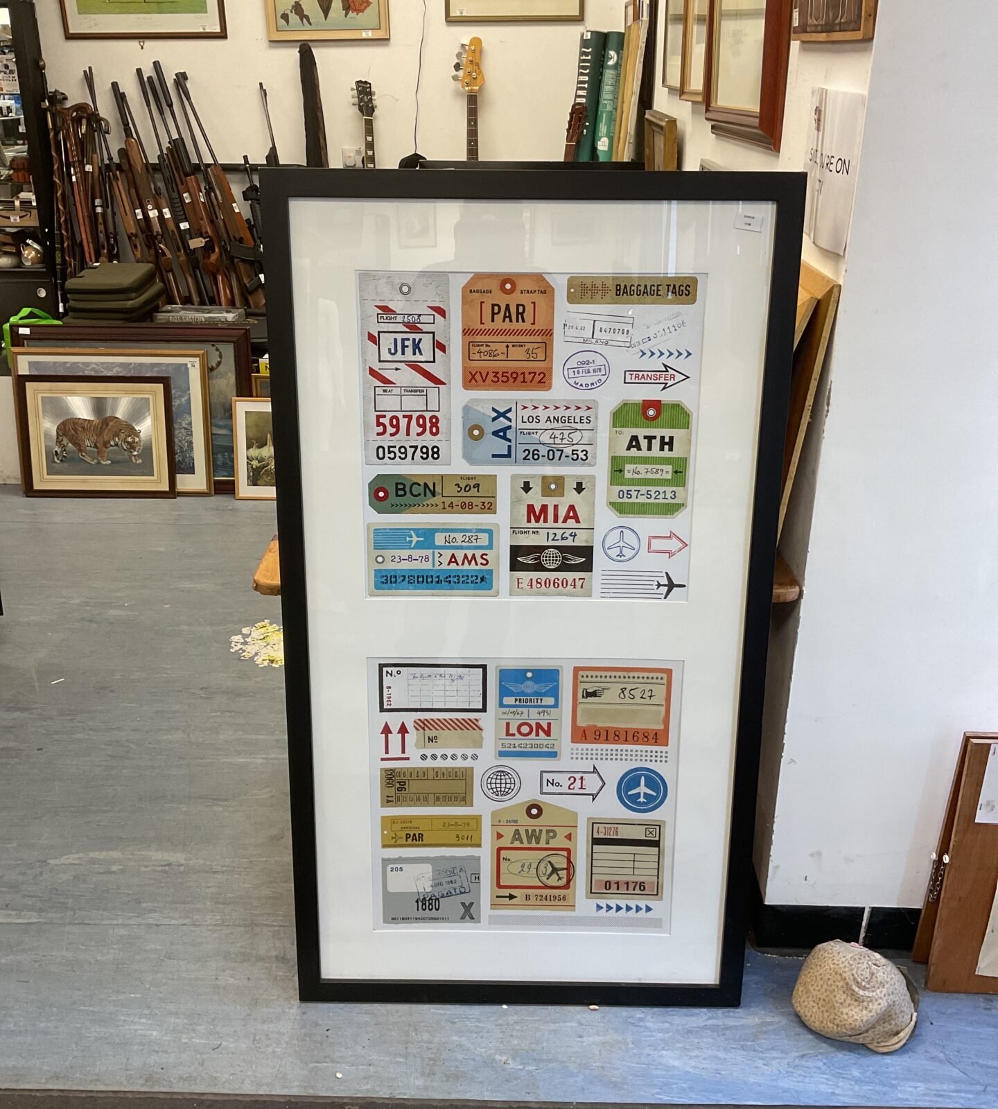 Large framed print of luggage tags