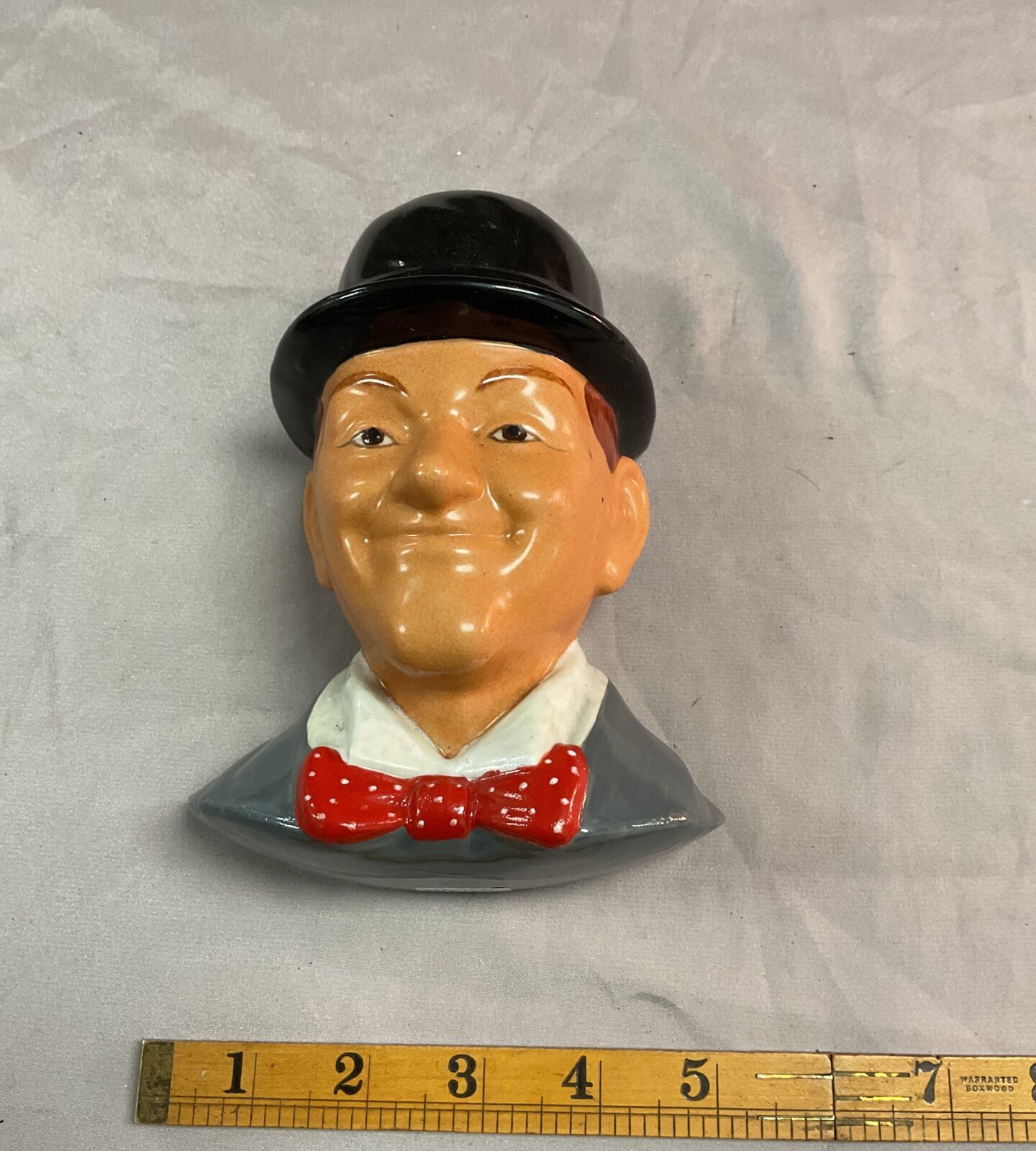 Ceramic stan laurel wall mount figure