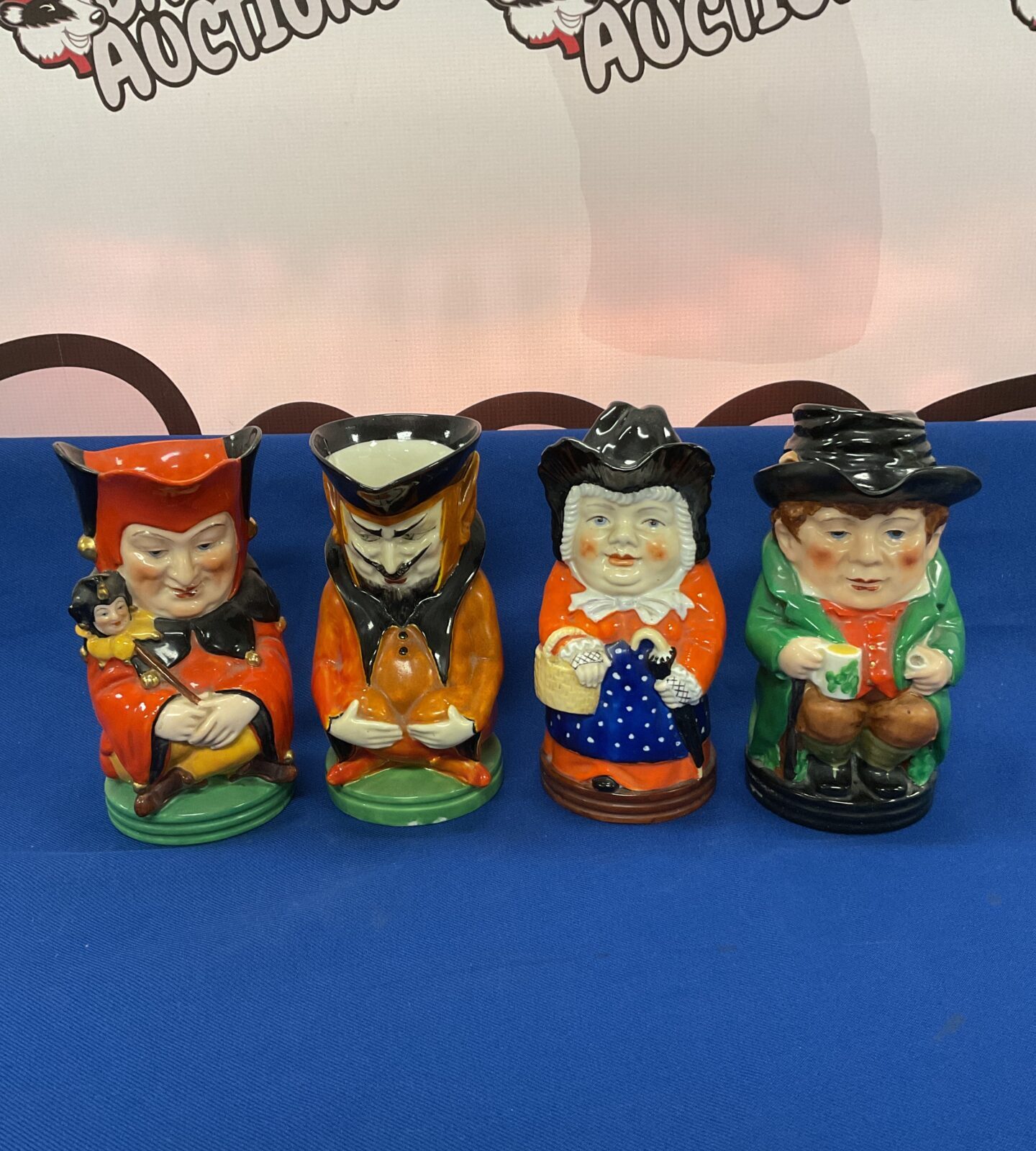 Four royal Worcester character jugs including the devil & jester