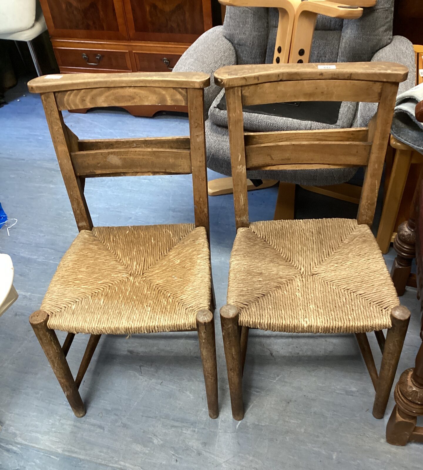 Two antique woven seated chapel chairs