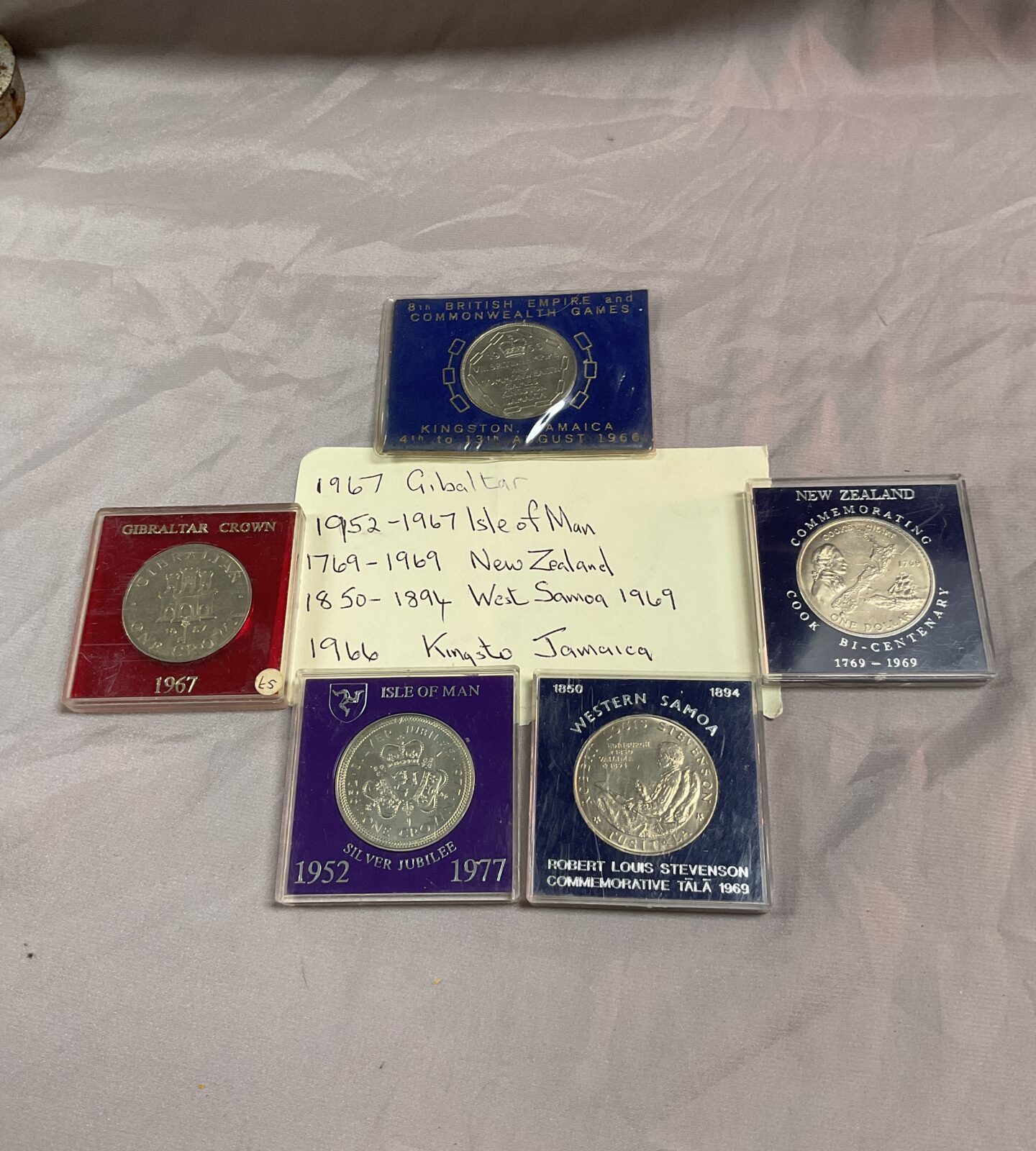 Four  crowns and dollar commemorative coins