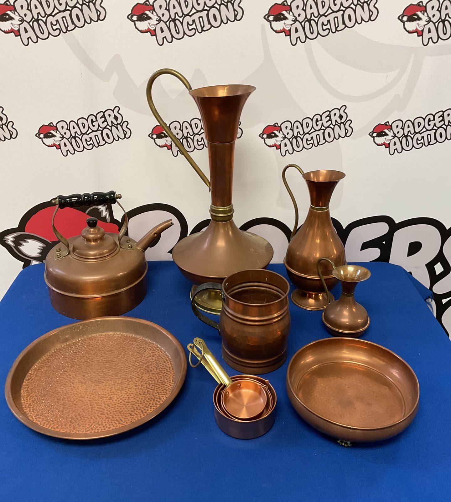 Selection of copper including pitchers, tankard & claw footed bowl