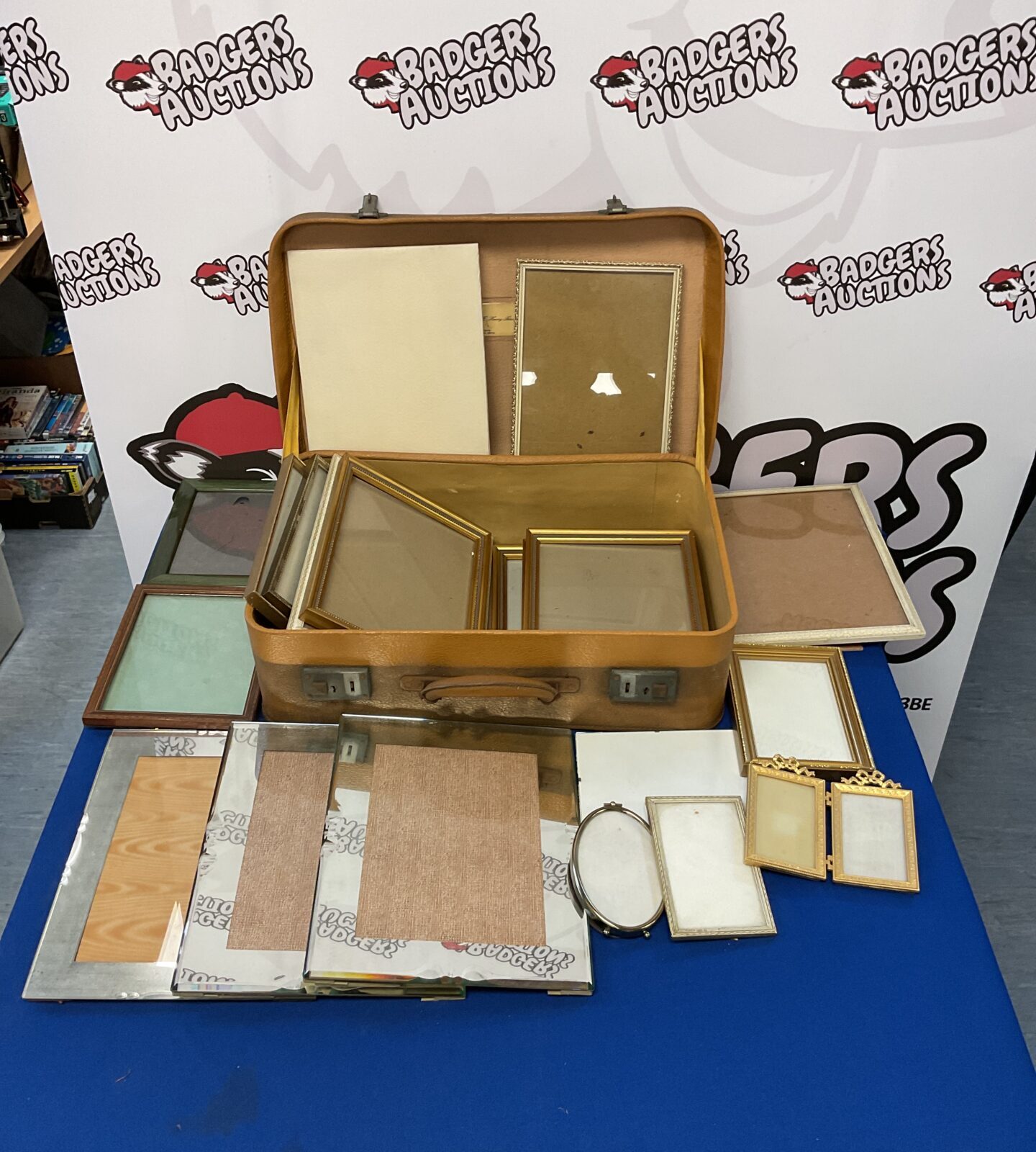 Vintage childs travel case with collection of empty photo frames