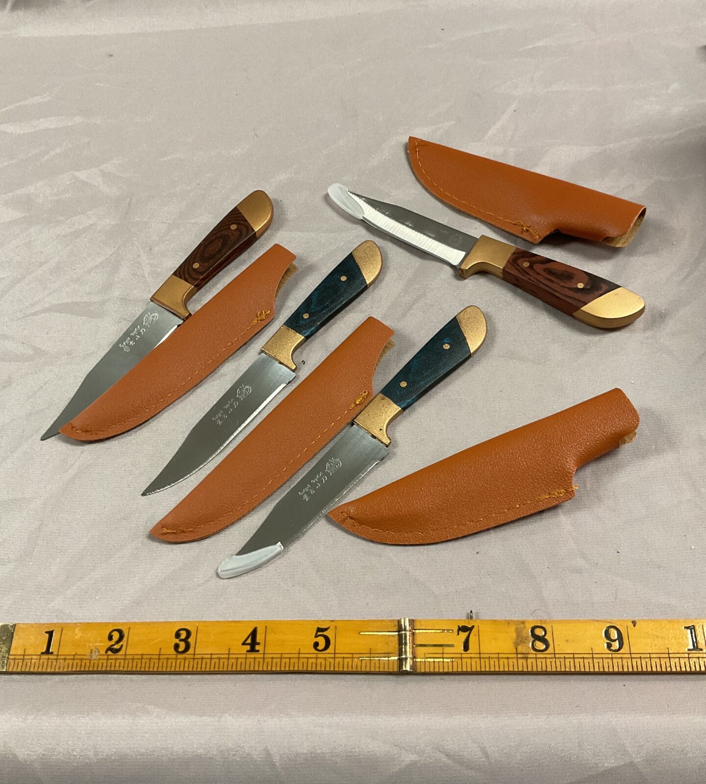 Four small sheath knives