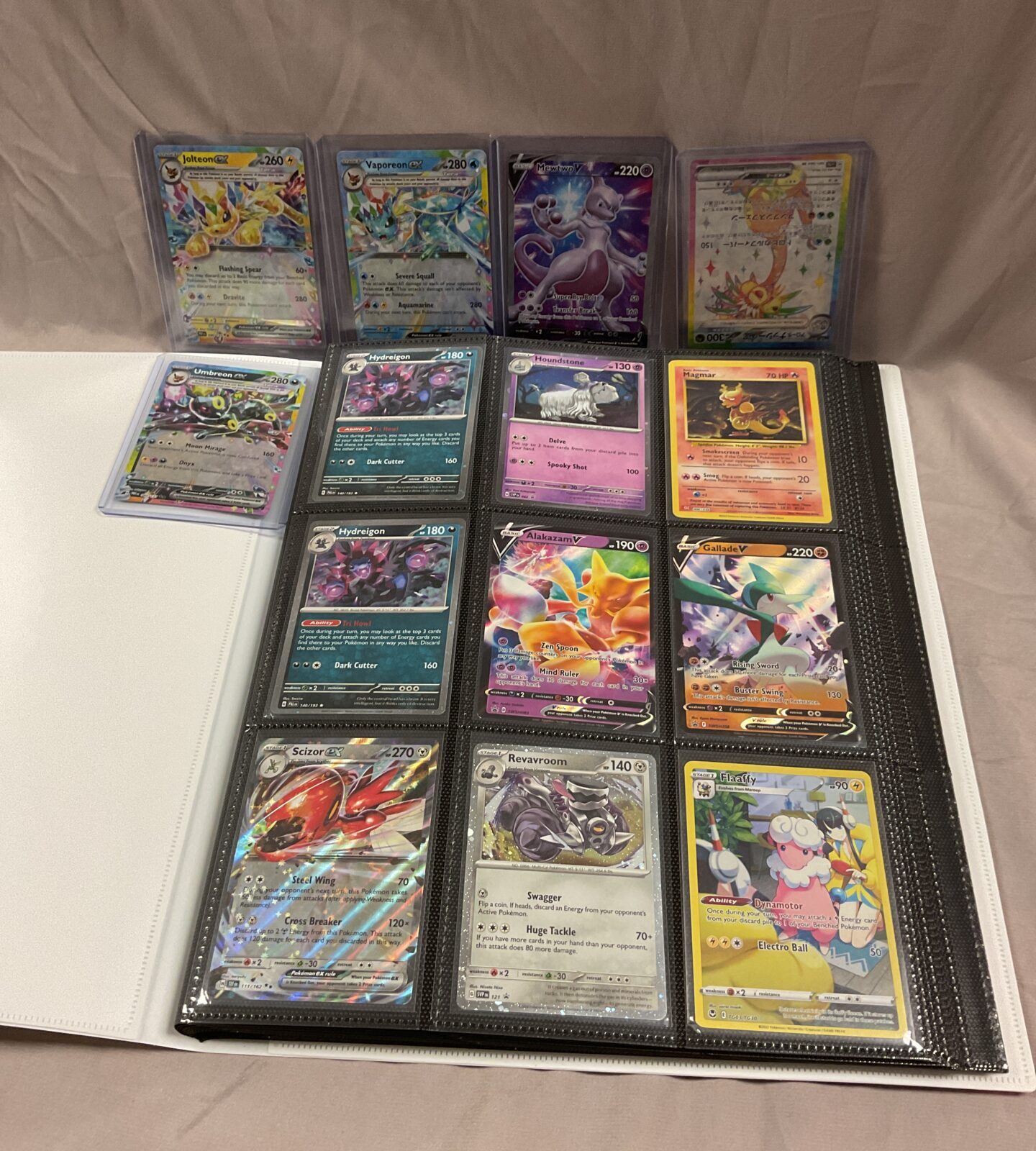 Folder of Pokemon cards in holo’s