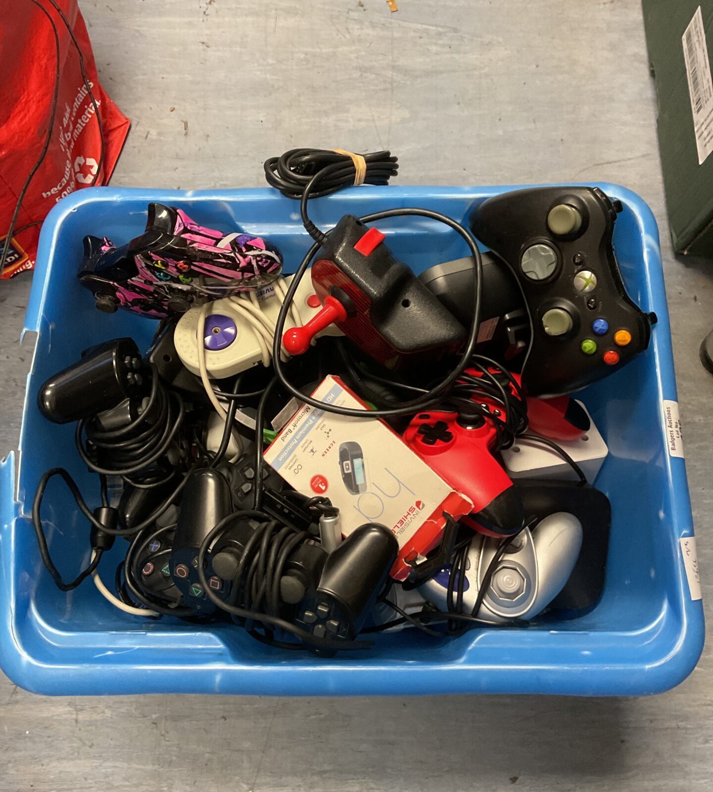 Box of gaming joysticks & controllers