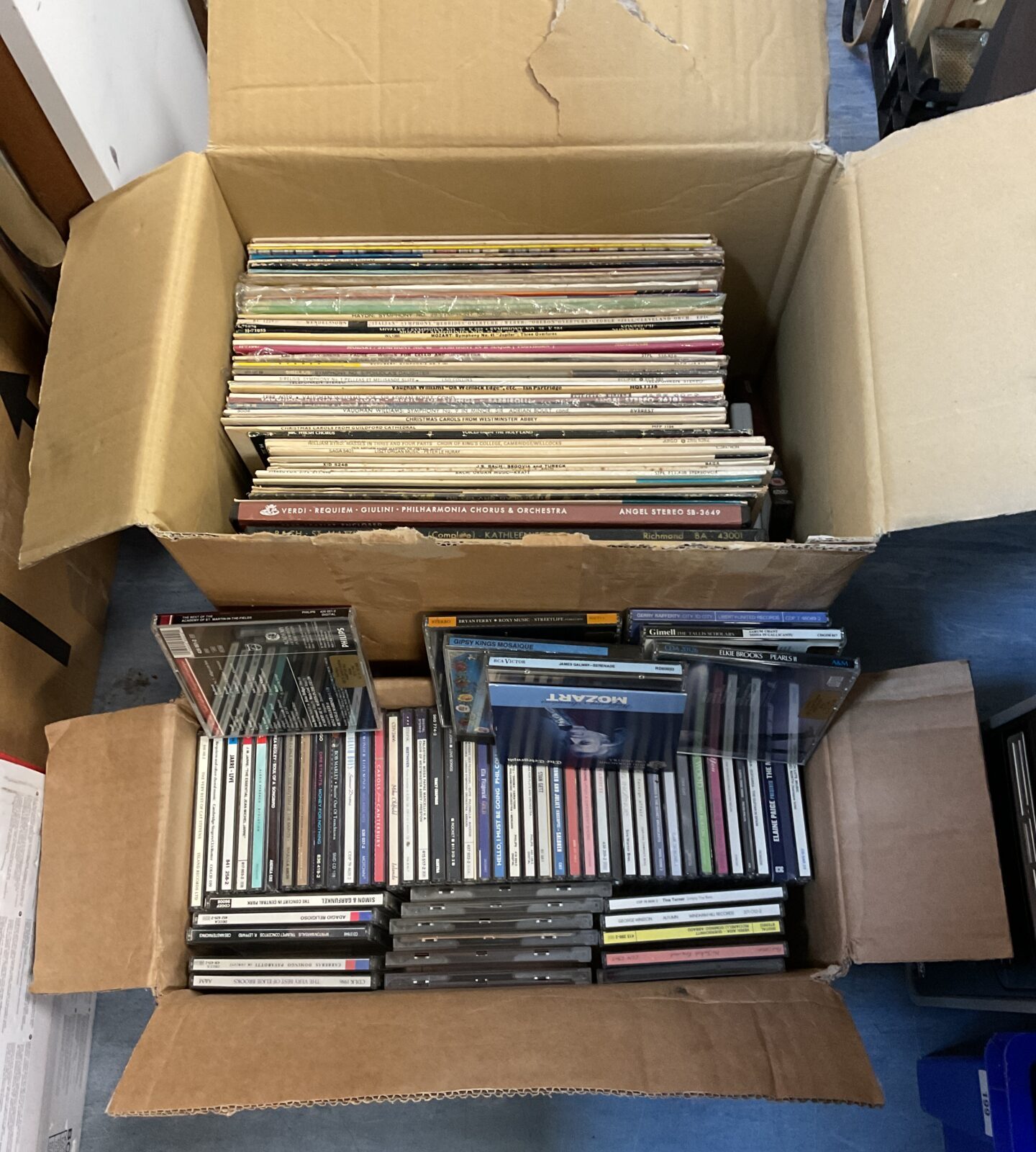 Box of 12” vinyl records & music cds
