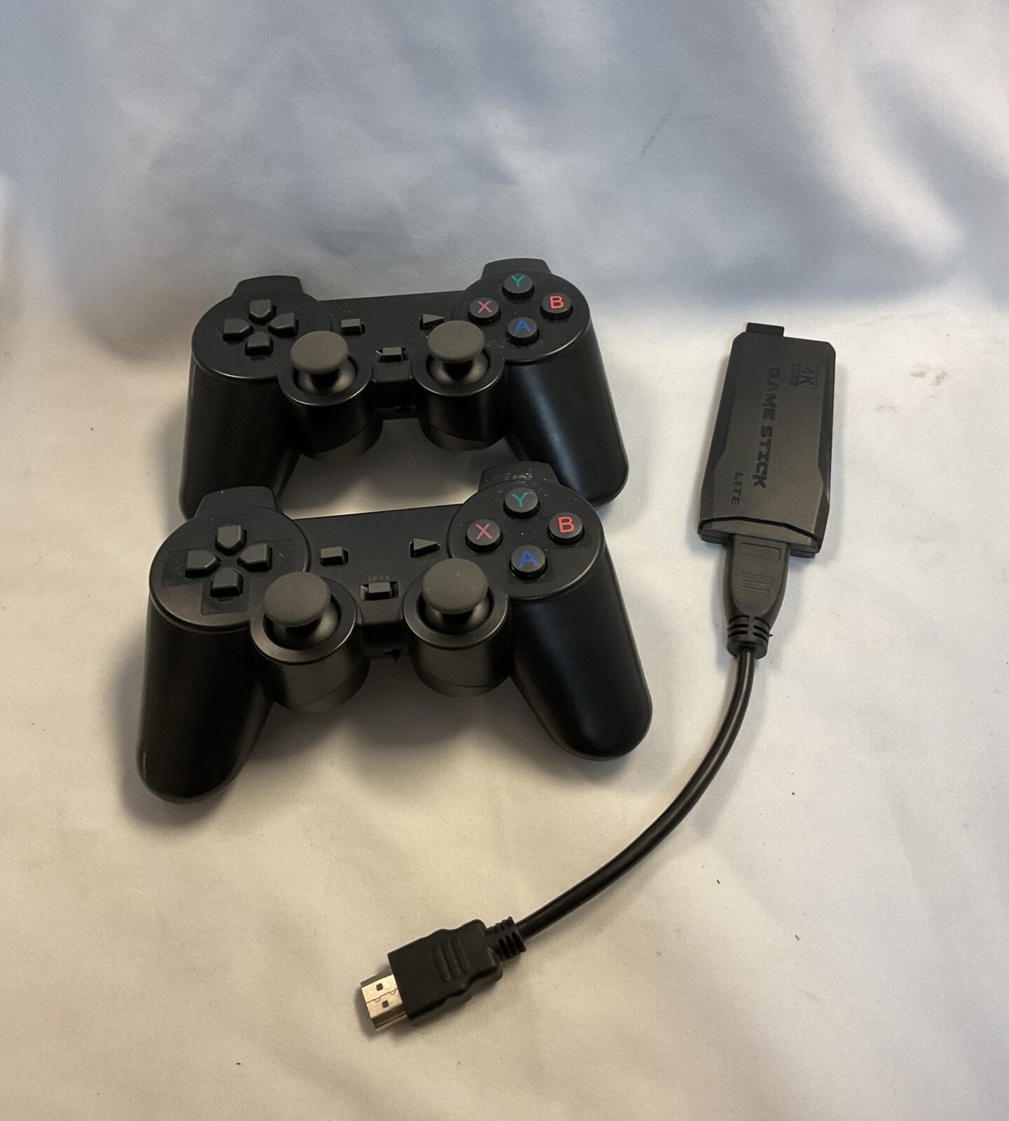 Two third party PlayStation 3 controllers & gamestick lite 4k