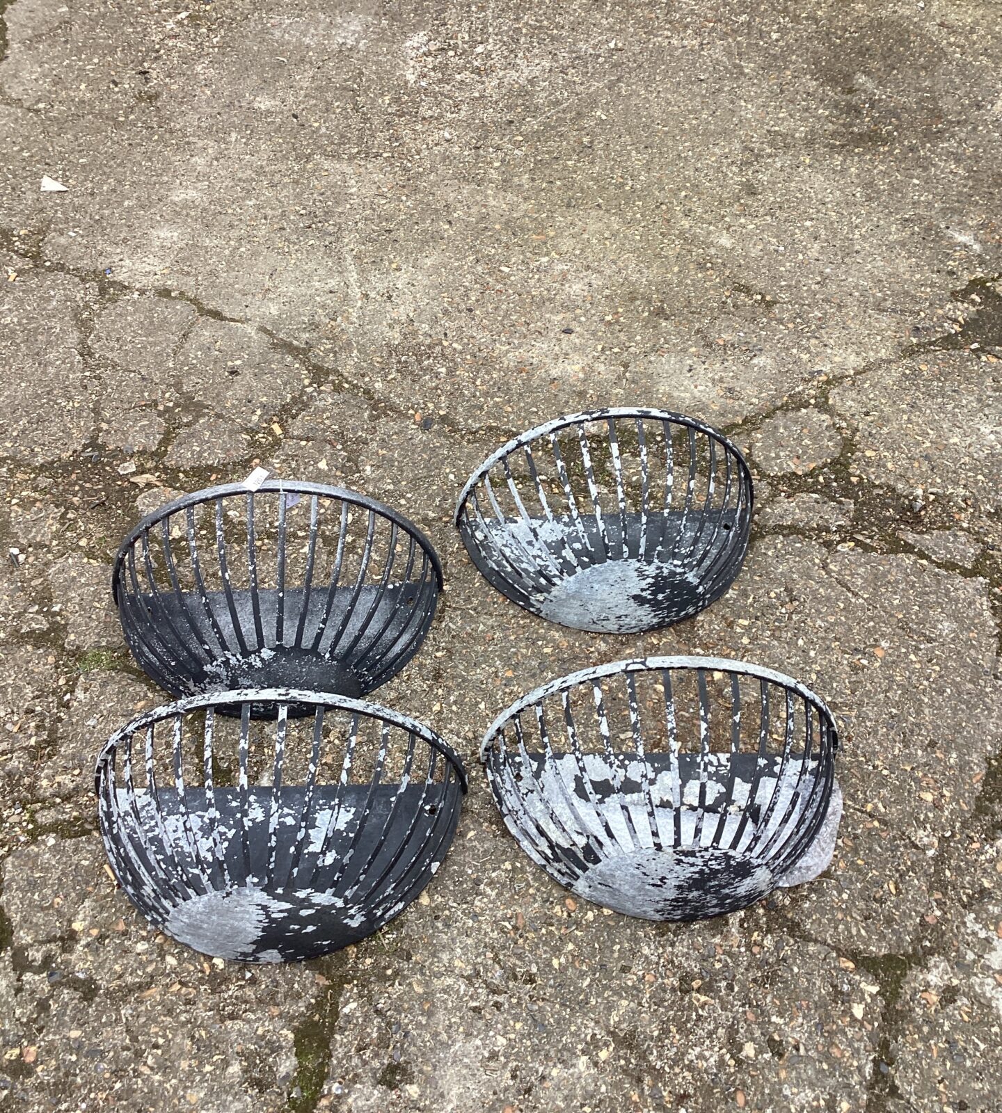 Four metal wall hanging baskets