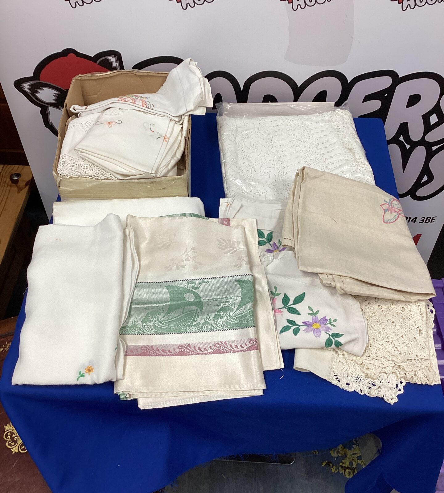 Box of linen table cloths
