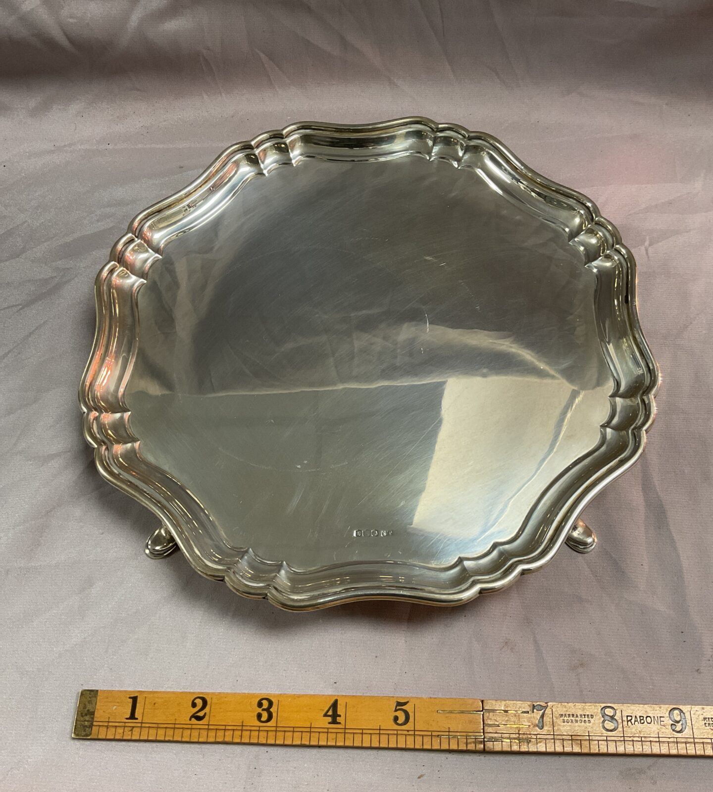 A Hallmarked Silver scalloped edge tray raised on four pad feet Sheffield,1919 by Stevenson & Law 520g